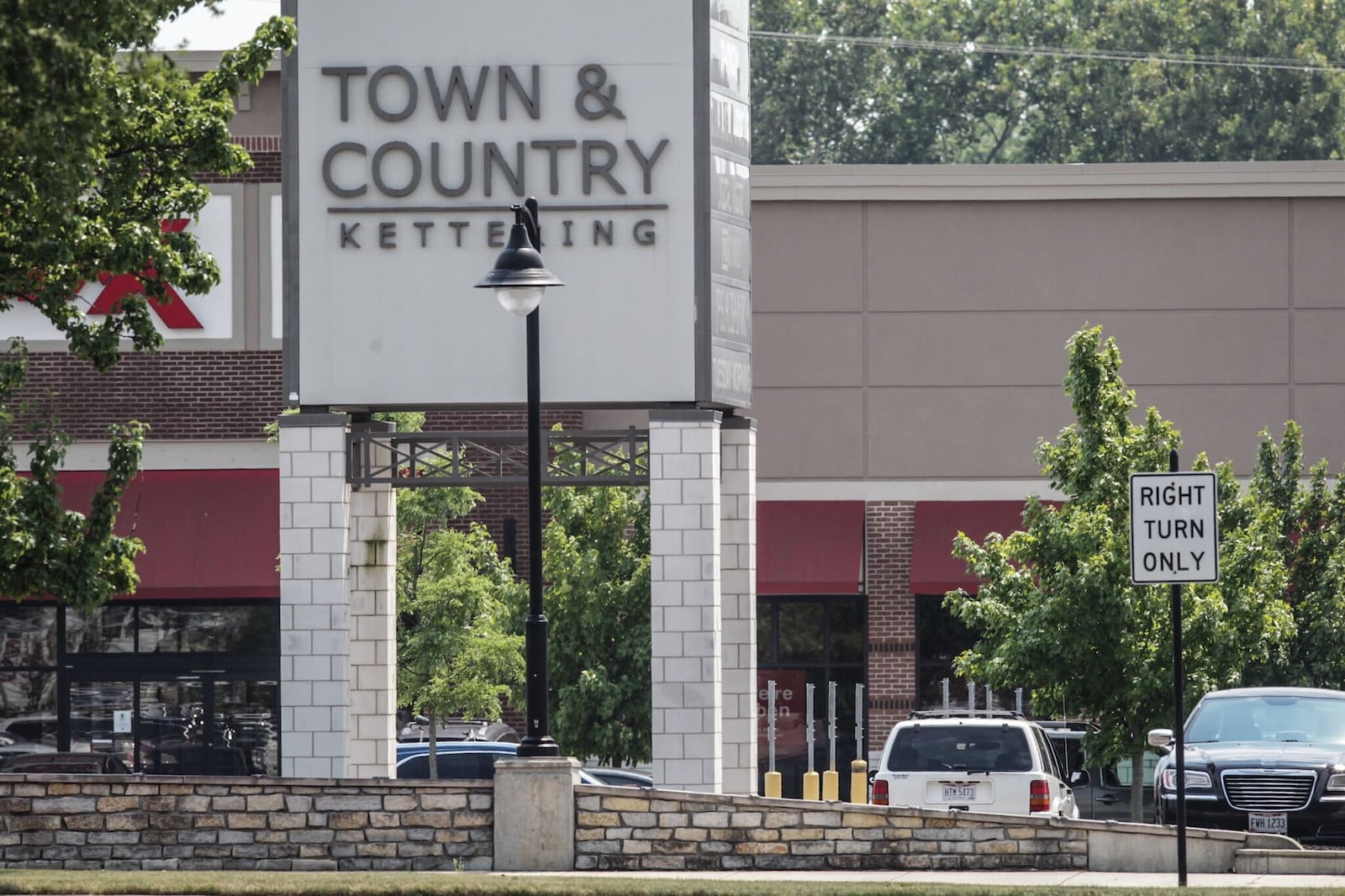 The city of Kettering plans to sell land next to Town & Country Shopping Center as part of a deal for the plaza’s owners to redevelop part of the retail center. JIM NOELKER / STAFF