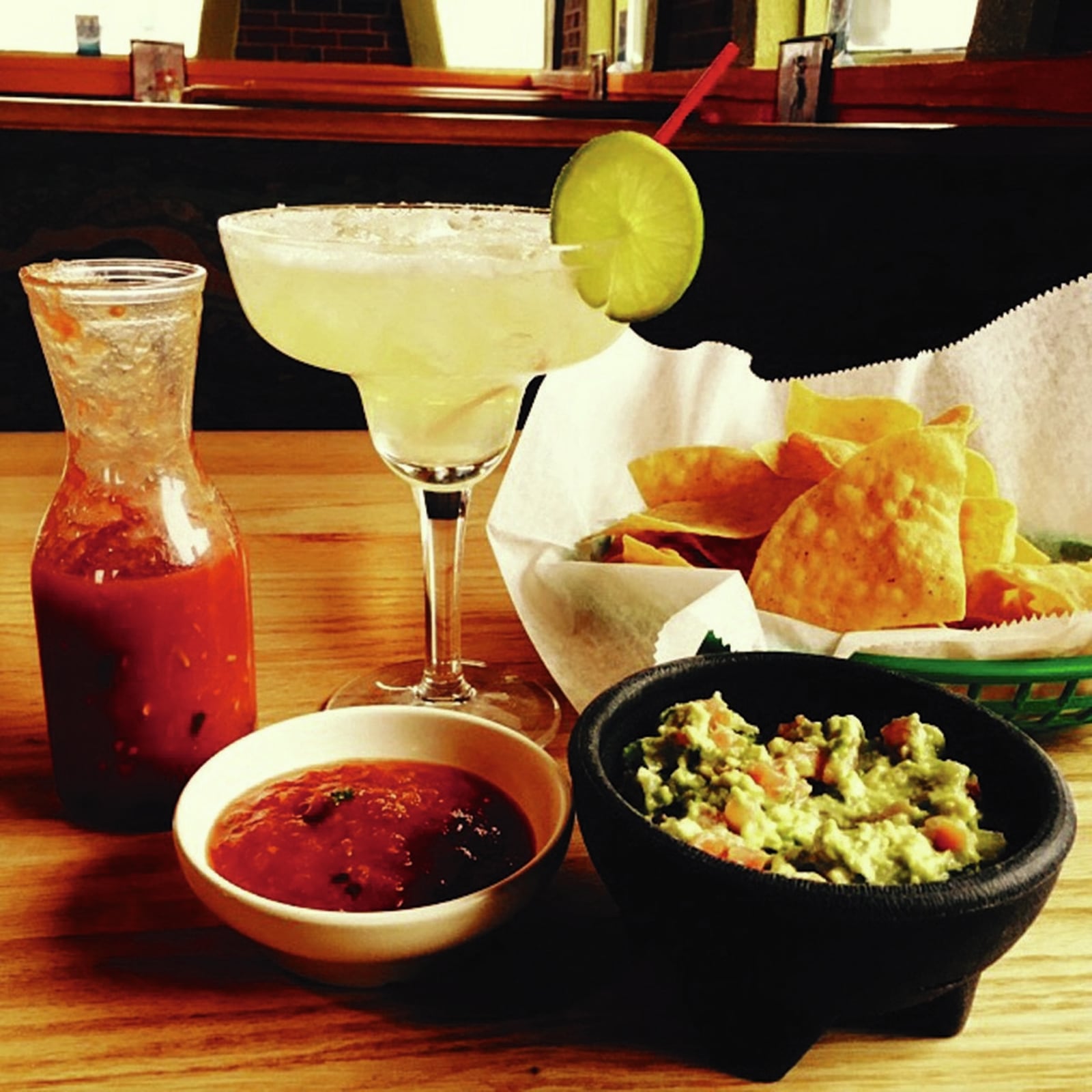 Salsa, guacamole, chips and an ice cold margarita served up at Taqueria Mixteca’s Trotwood location. CONTRIBUTED/ALEXIS LARSEN