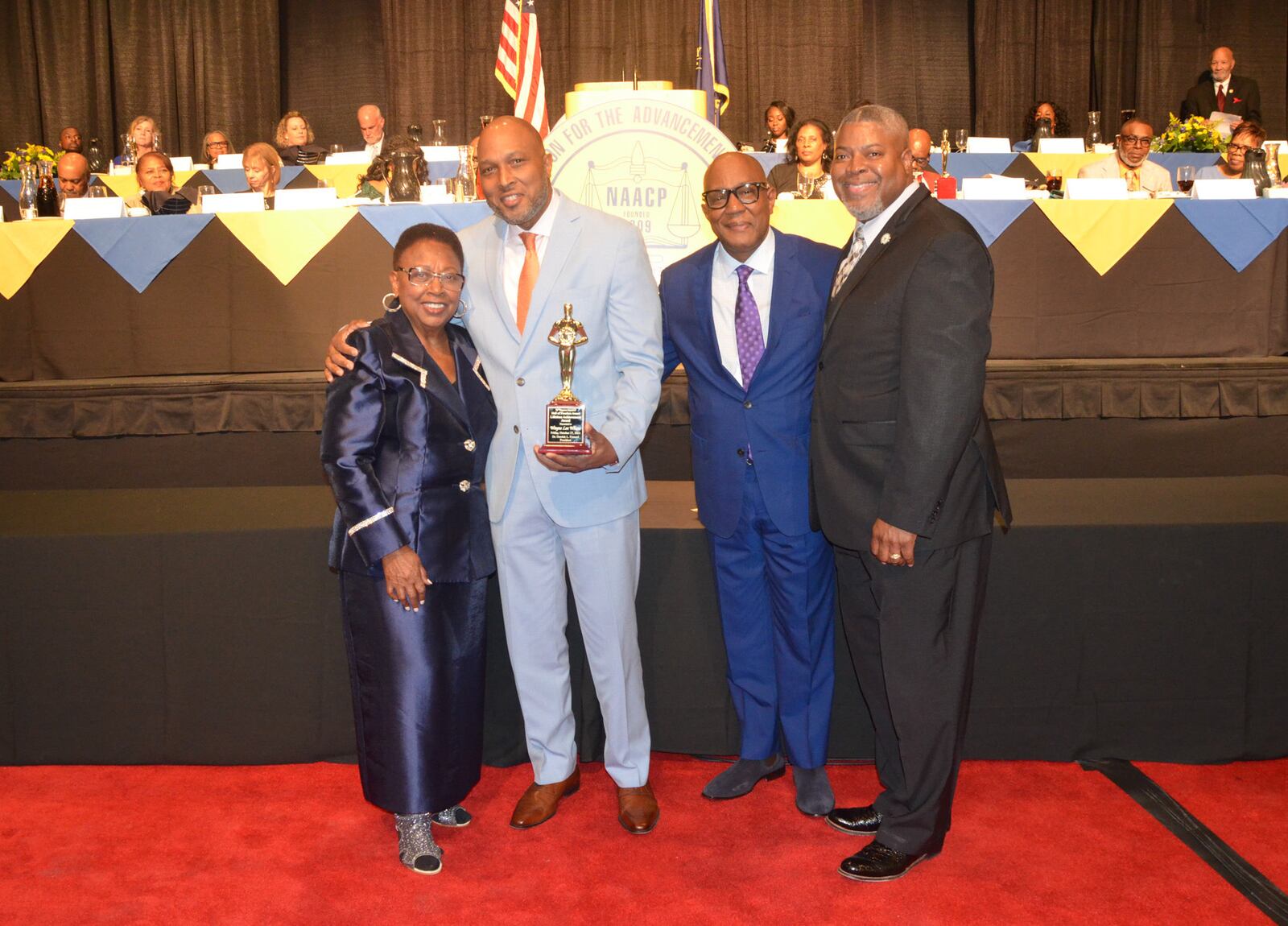 Wayne Lee Wheat was honored with the Lifetime Achievement Award at the Dayton Unit NAACP's 2023 Hall of Freedom awards. From left are Lu Dale, chair of the NAACP Freedom Fund Committee; Wayne Wheat's sons Stacy Wheat and Tony Wheat accepting on his behalf; and NAACP President Derrick Foward.