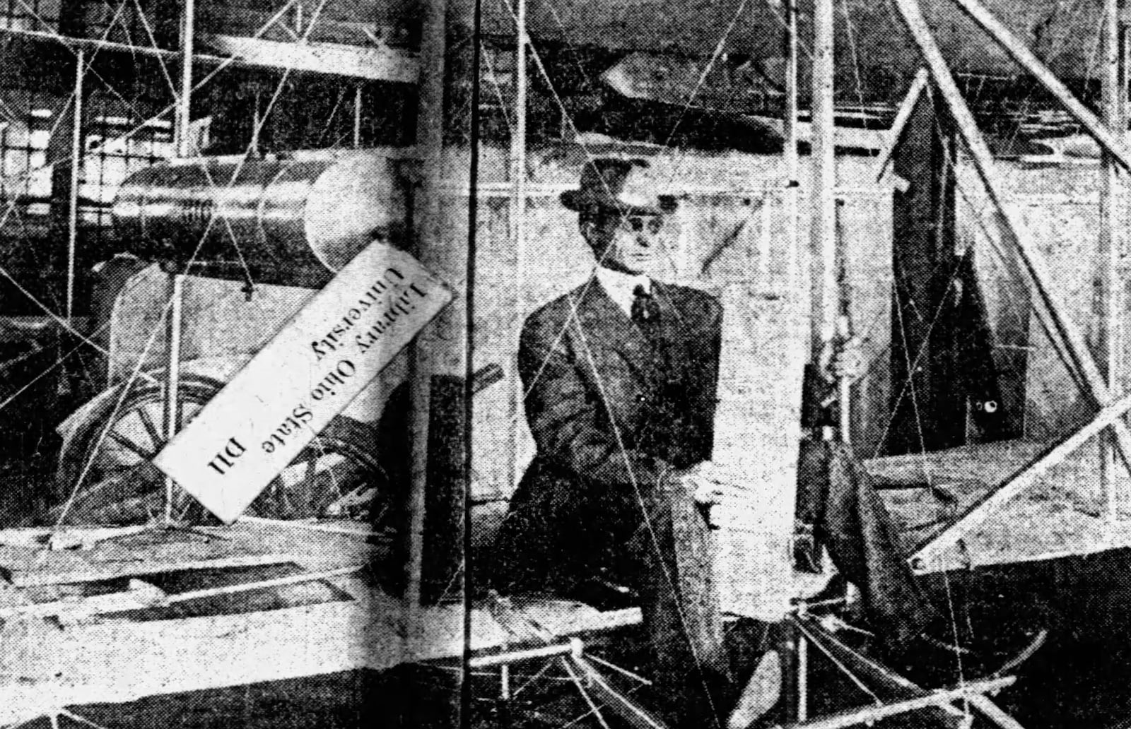 Max Morehouse, of the Morehouse-Martens Co. seated in the Wright machine, and the silk which was conveyed to the Arch City in the biplane. The silk is valued at $800. DAYTON HERALD ARCHIVE