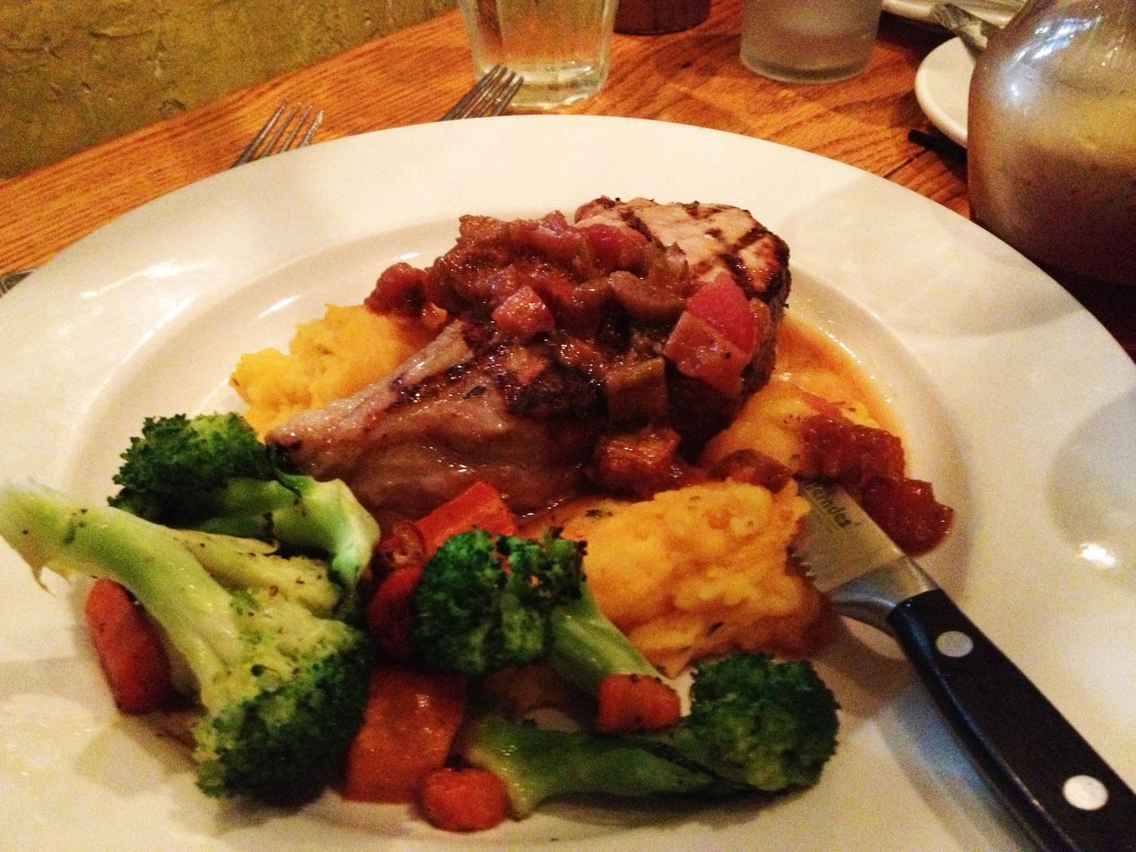 American Homestead Pork Chop with Roasted Rhubarb ($20) featuring a single cut brined pork chop accented by a rhubarb sauce. Served with carrot thyme mashed potatoes and fresh vegetables. Contributed photo by Alexis Larsen