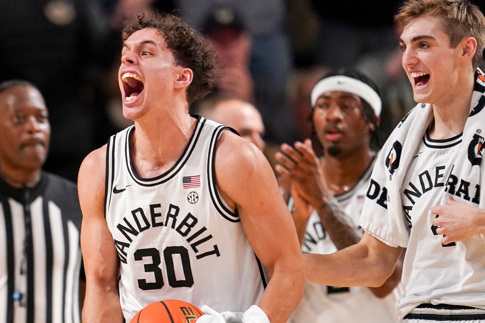 Vanderbilt guard Chris Manon (30) and guard Grant Huffman, right, celebrate during the first half of an NCAA college basketball game against Tennessee, Saturday, Jan. 18, 2025, in Nashville, Tenn. (AP Photo/George Walker IV)