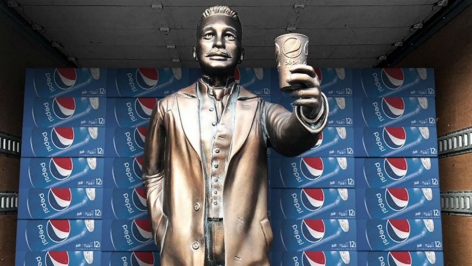 A statue of Pepsi founder Caleb Bradham was delivered to the World of Coca-Cola on Wednesday and placed in front of the statue of Coca-Cola founder John Pemberton, as part of a promotional "cola truce" during Super Bowl week. Pepsi is an official sponsor of the Super Bowl and has placed highly visible advertising across downtown Atlanta. Coca-Cola apparently had not received advance notice but played along with the stunt, saying through a spokesperson, "We are going to welcome them with a Coke and a smile." (Photo: Pepsi)