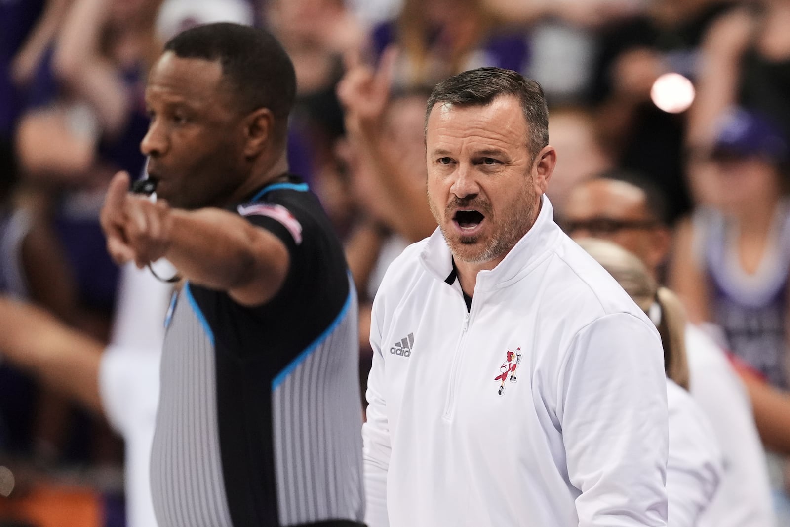 Louisville head coach Jeff Walz shouts at an official in the second half in the second round of the NCAA college basketball tournament game against TCU in Fort Worth, Texas, Sunday, March 23, 2025. (AP Photo/Tony Gutierrez)