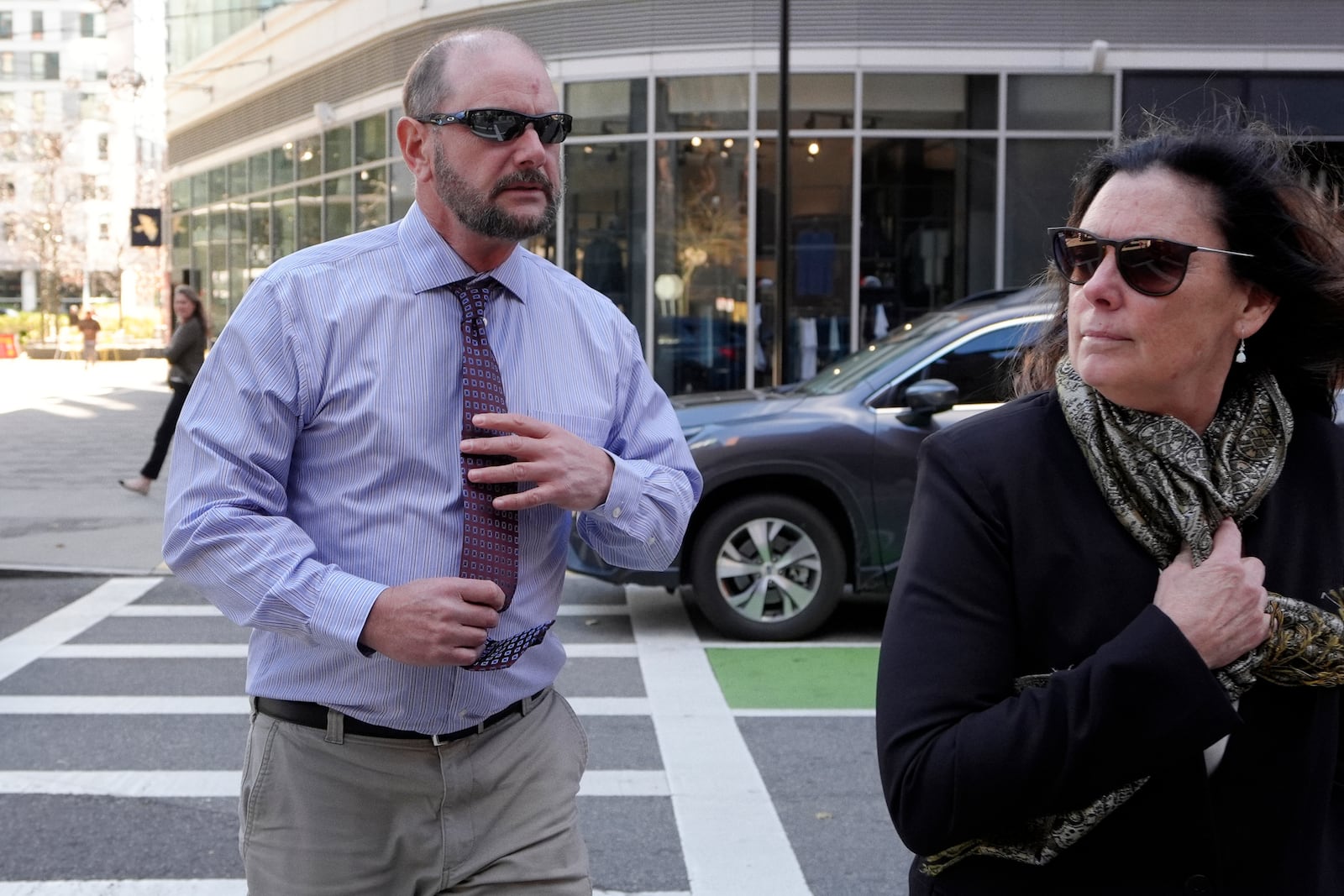 Jack Michael Teixeira, center, father of Massachusetts Air National Guardsman Jack Teixeira. arrives at federal court for his son's sentencing hearing, Tuesday, Nov. 12, 2024, in Boston,. (AP Photo/Steven Senne)