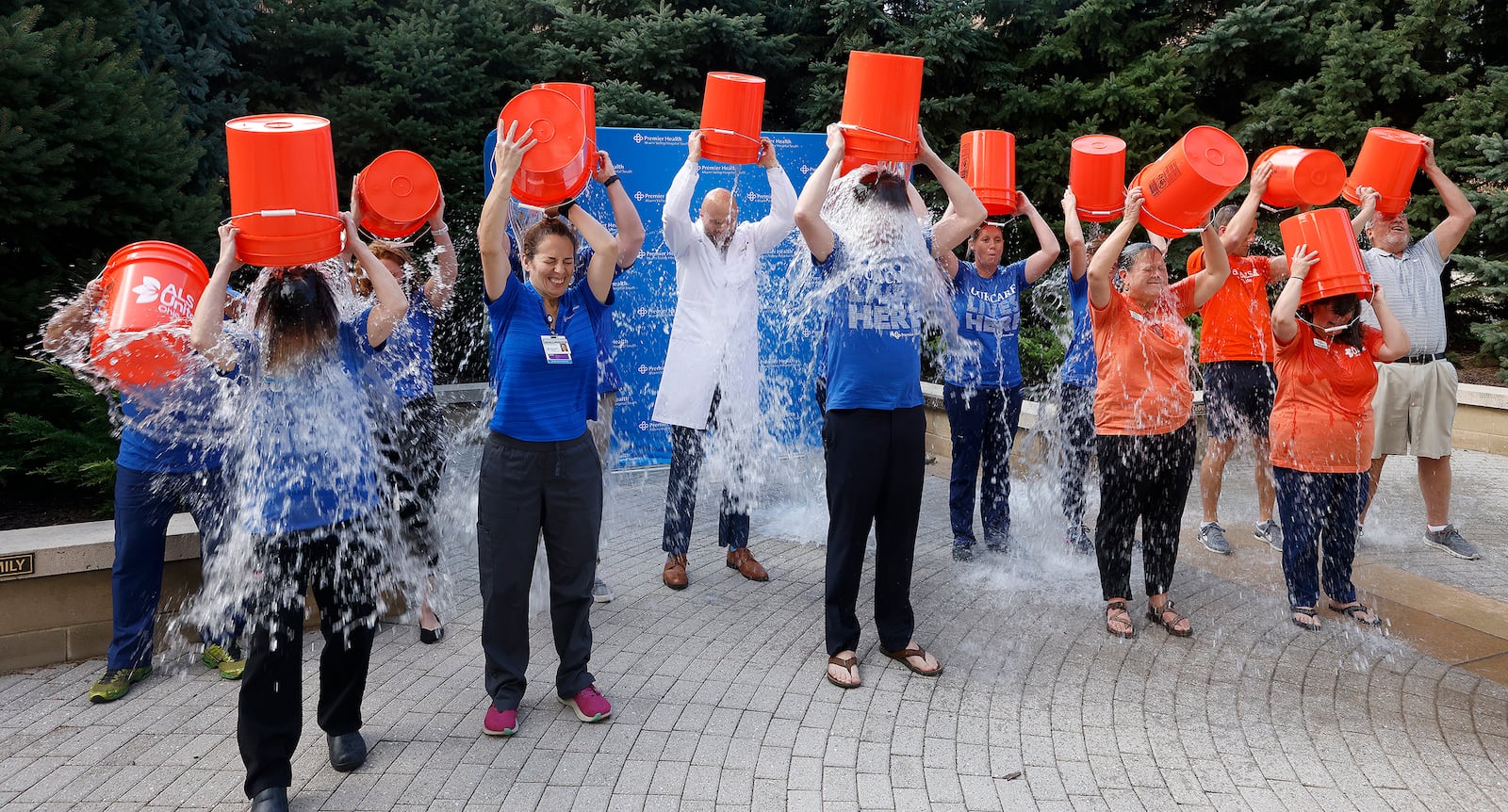 Officials with Premier Health and ALS United Ohio commemorate the 10th anniversary of the viral Ice Bucket Challenge with a special event at Miami Valley Hospital South Friday, Sept. 20, 2024 . The celebration marked the grand opening of a new Multidisciplinary ALS Clinic at the Clinical Neuroscience Institute, which is scheduled to see its first patients in October. MARSHALL GORBY/STAFF