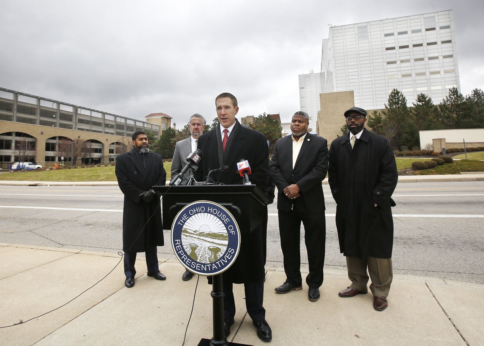 State Representatives Jim Butler (R-Oakwood) at podium, and Minority Leader Fred Strahorn (D-Dayton), left, held a press conference with other local civic leaders where they announced legislation to address the preservation of Good Samaritan Hospital and other hospital facilities for essential citizen access. TY GREENLEES / STAFF