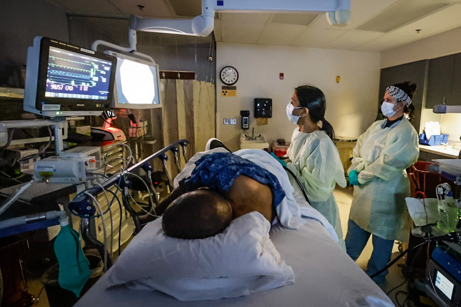 Dayton VA Dr. Saneeta Agrawal performs a colonoscopy on Army Veteran, Vincent Epps using technology to detect polyps. The RN on the right is Karen Cockerham.
JIM NOELKER/STAFF