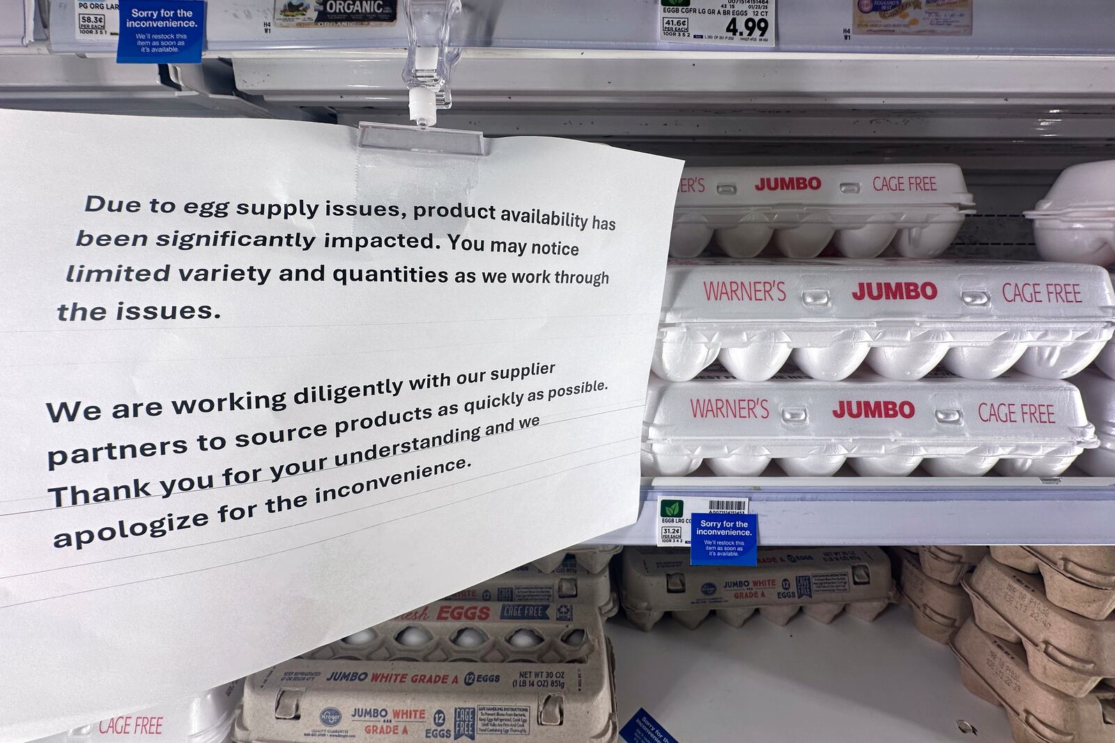 FILE - A sign is shown with egg cartons for sale at a grocery store Friday, Feb. 14, 2025 in Grosse Pointe Woods, Mich. (AP Photo/Paul Sancya, File)