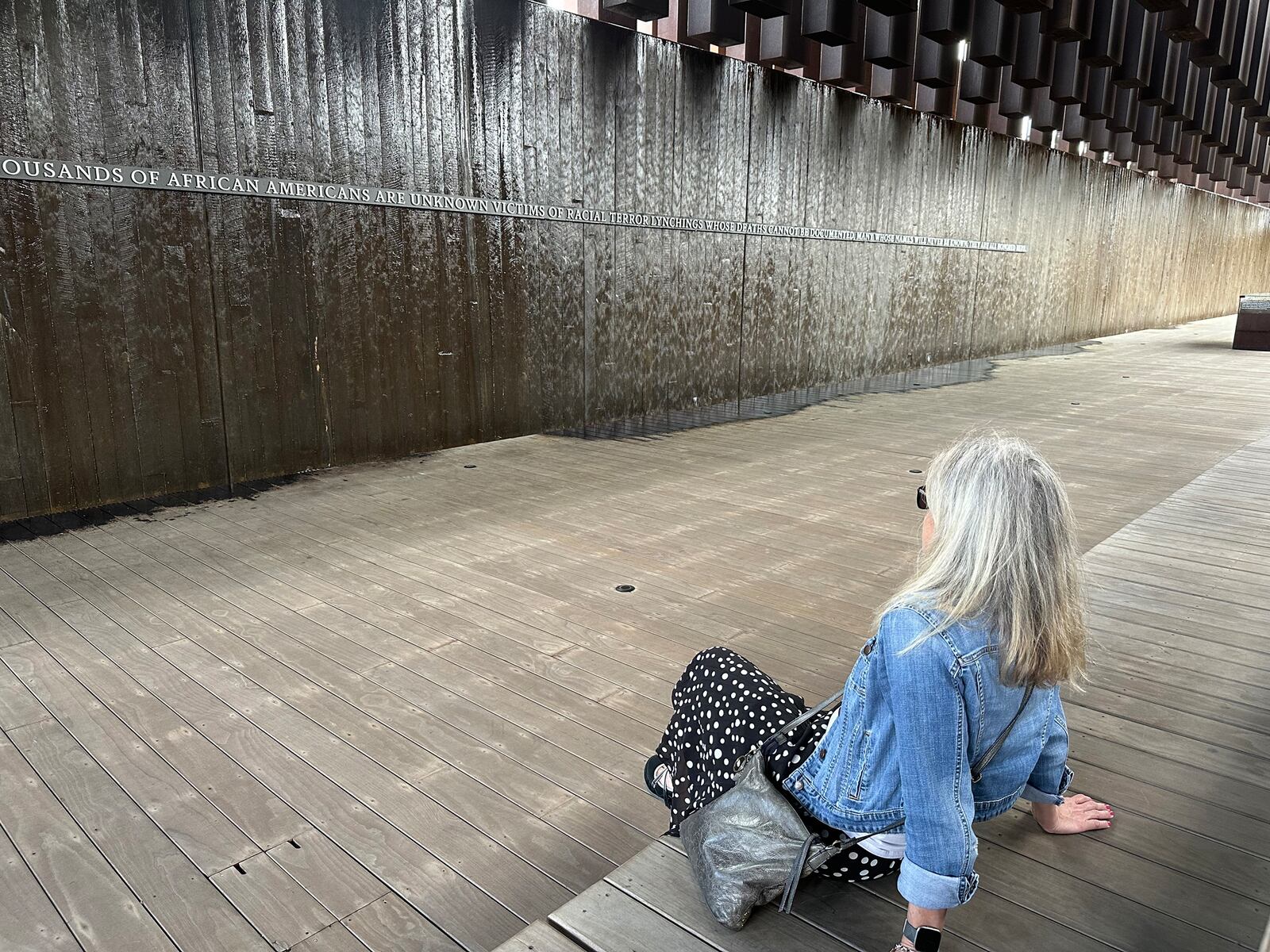 Bridget sits in contemplation at Legacy Memorial.