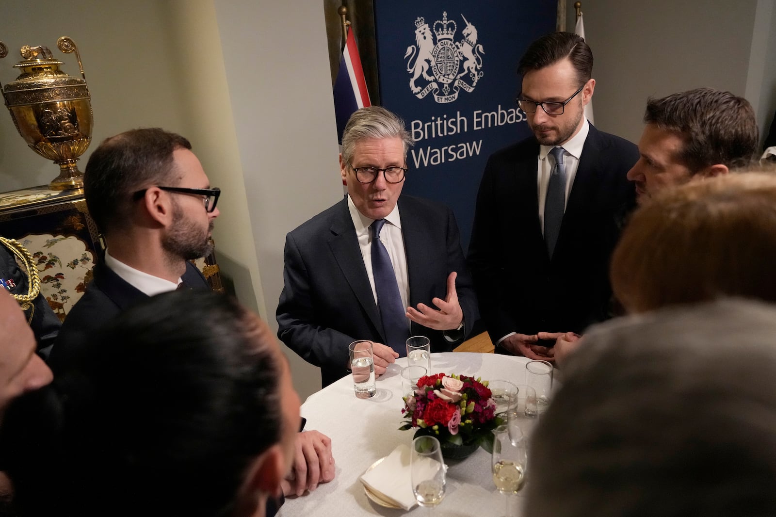 Britain's Prime Minister Keir Starmer chats with business leaders as he attends a business reception at the British Embassy in Warsaw, Friday, Jan. 17, 2025. (AP Photo/Czarek Sokolowski, Pool)