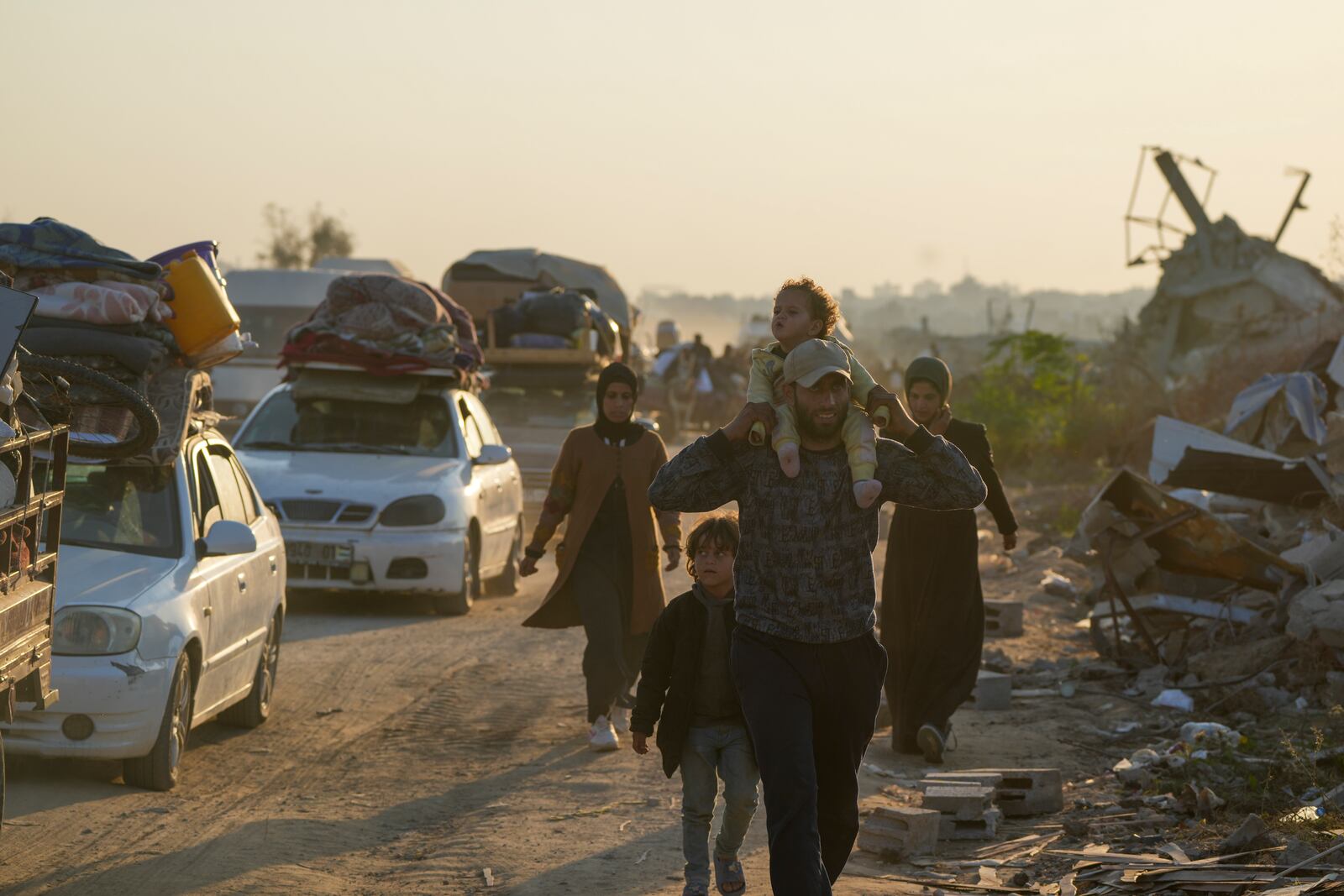 Displaced Palestinians make their way from central Gaza to their homes in the northern Gaza Strip, Wednesday, Jan. 29, 2025. after Israel began allowing hundreds of thousands of Palestinians to return as part of the ceasefire deal between Israel and Hamas. (AP Photo/Abdel Kareem Hana)