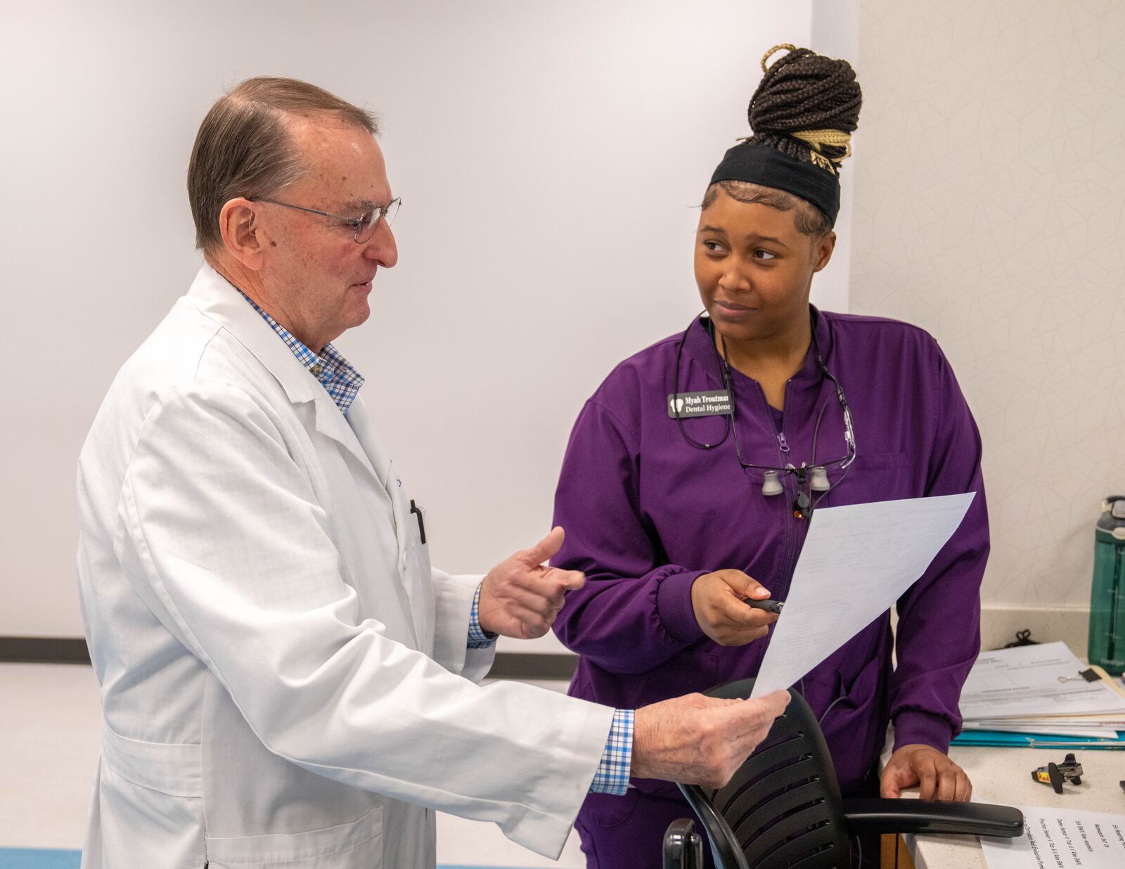 Faculty Dentist Dr. Dale Mateer confers with dental hygienist student Myah Troutman  CONTRIBUTED