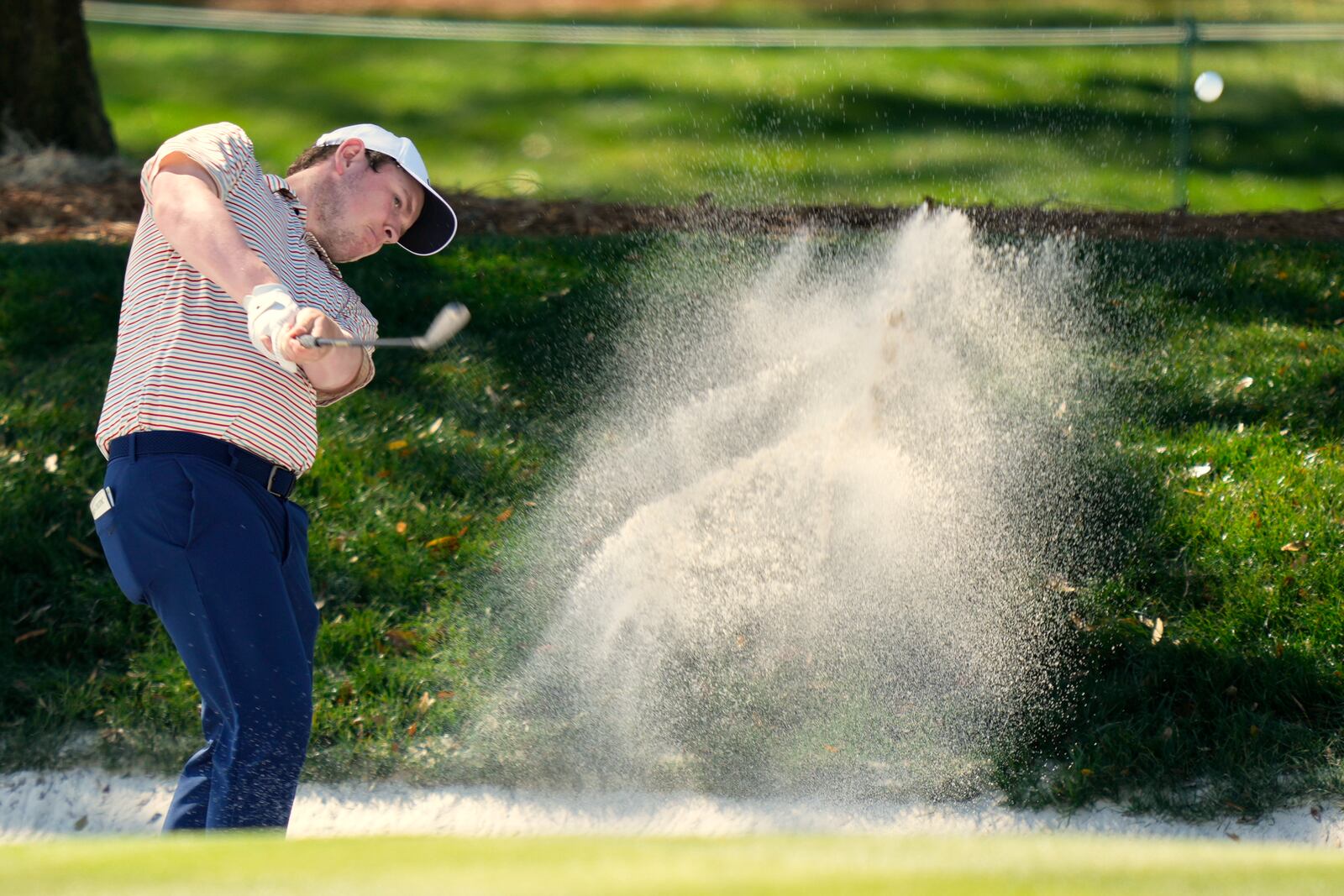 Robert MacIntyre hits out of a bunker on the ninth hole during the first round of The Players Championship golf tournament Thursday, March 13, 2025, in Ponte Vedra Beach, Fla. (AP Photo/Julia Demaree Nikhinson)