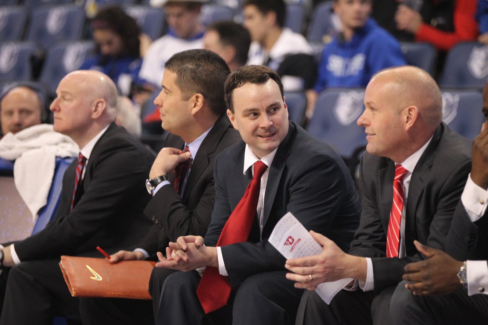 Archie Miller smiles on the bench during a game against Saint Louis. David Jablonski/Staff