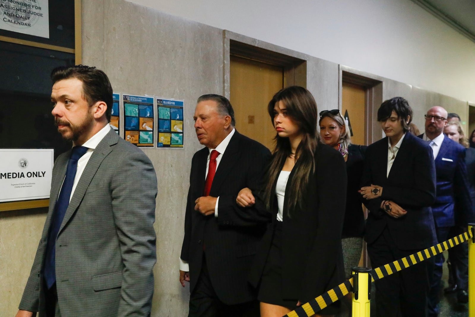 FILE - Tim Oliver Lee, left, brother of Cash App founder Bob Lee, Rick Lee, second left, father of Bob Lee; Krista Lee, fourth left, ex-wife of Bob Lee, and other family members of Bob Lee walk to Department 28 to enter the courtroom at the Hall of Justice on the first day of the murder trial of Nima Momeni, Monday, Oct. 14, 2024 in San Francisco. (Lea Suzuki/San Francisco Chronicle via AP, File)