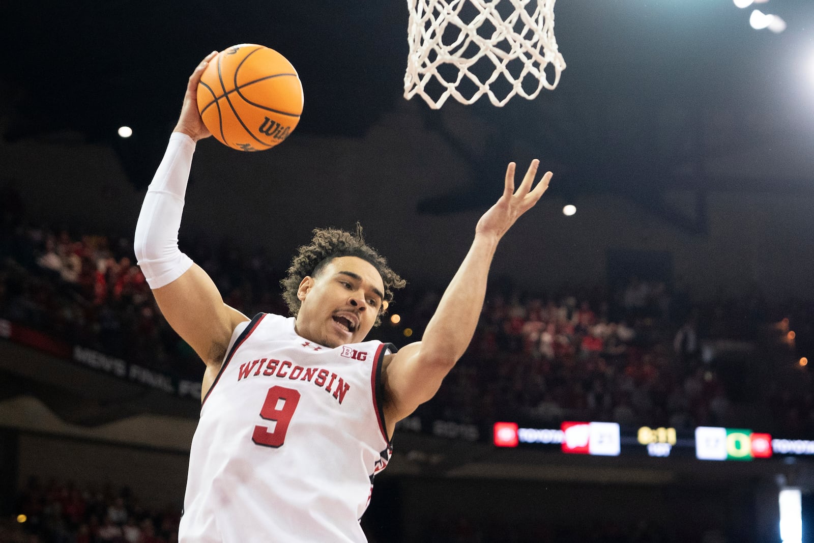 Wisconsin guard John Tonje (9) rebounds the ball during the first half against Oregon of an NCAA college basketball game Saturday, Feb. 22, 2025, in Madison, Wis. (AP Photo/Kayla Wolf)