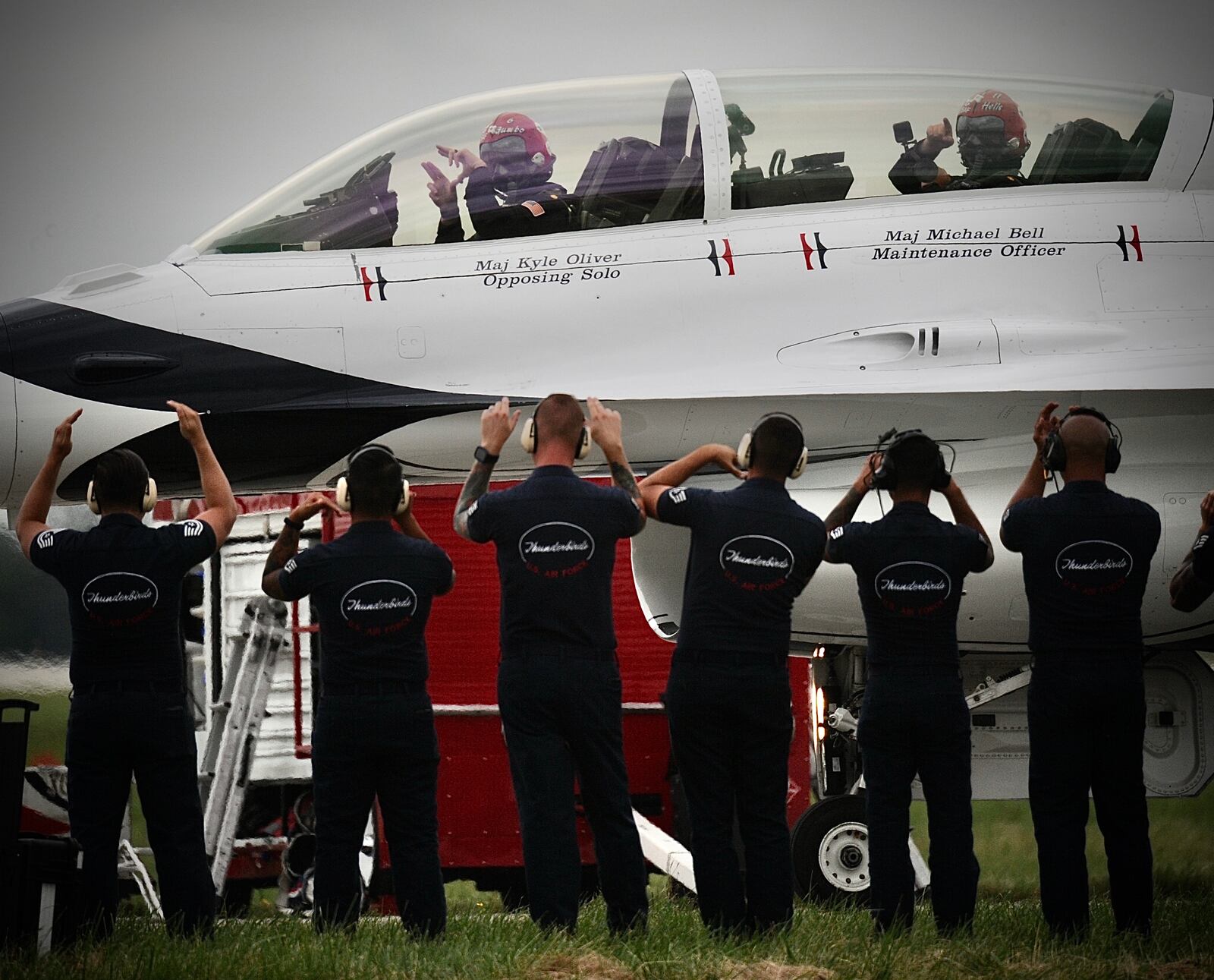 United States Air Force Thunderbird pilot Maj. Kyle Oliver from Beavercreek communicates with ground crews as he prepares to do a show on Friday at the CenterPoint Energy Dayton Air Show. MARSHALL GORBY\STAFF