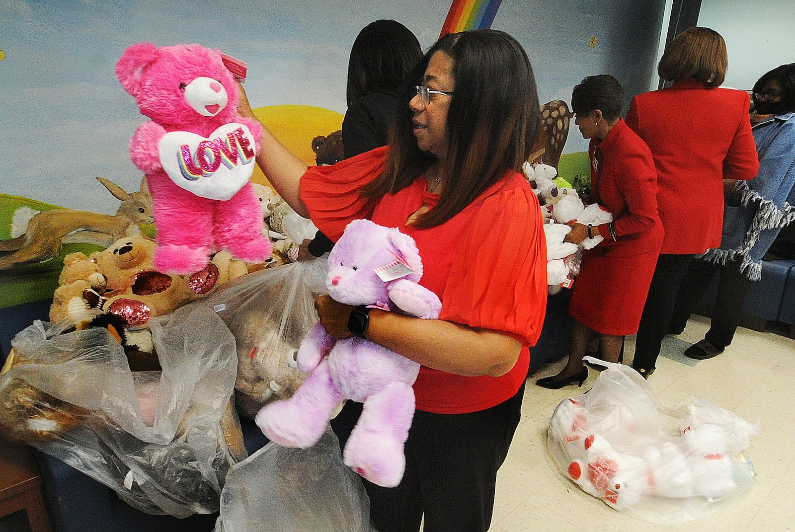 Teddy Bear Roundup Chair Donna Kuykendall and other ladies from the National Council of Negro Women’s Dayton Section donated nearly 500 stuffed toys to Montgomery County Children Services on Valentine’s Day, Wednesday, Feb. 14, 2024. MARSHALL GORBY\STAFF