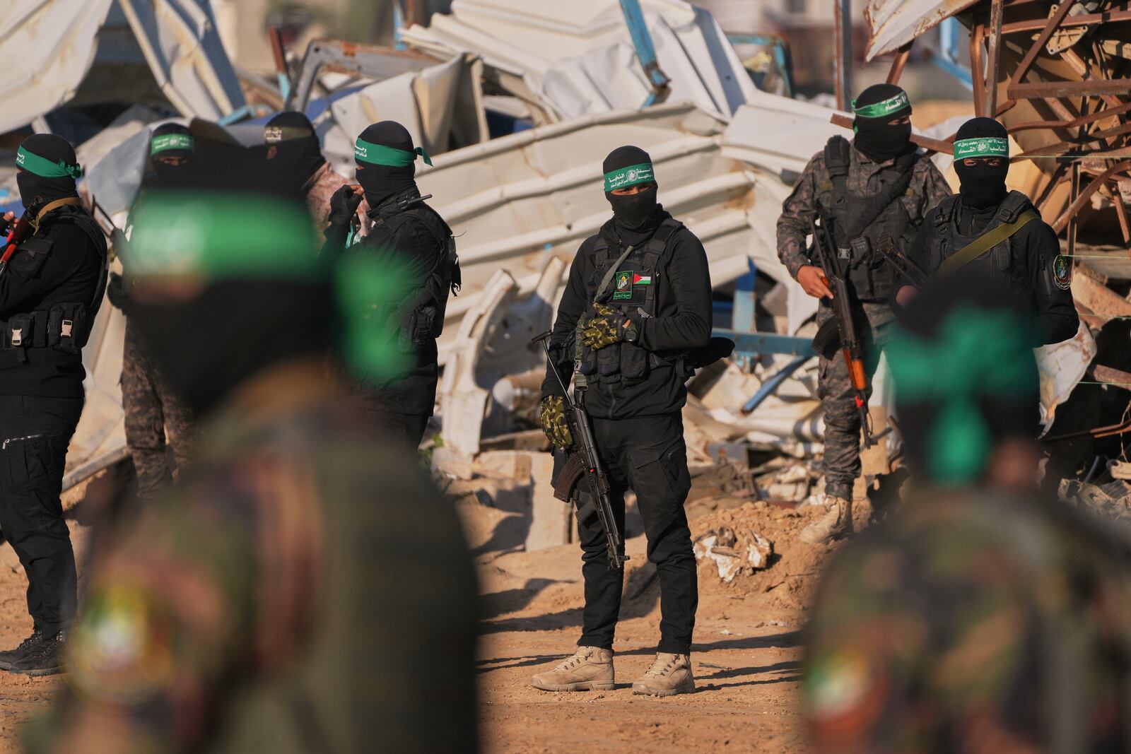 FILE - Hamas fighters take up positions ahead of a hostage release in Khan Younis, southern Gaza Strip, Saturday, Feb. 1, 2025. Photo/Abdel Kareem, File)