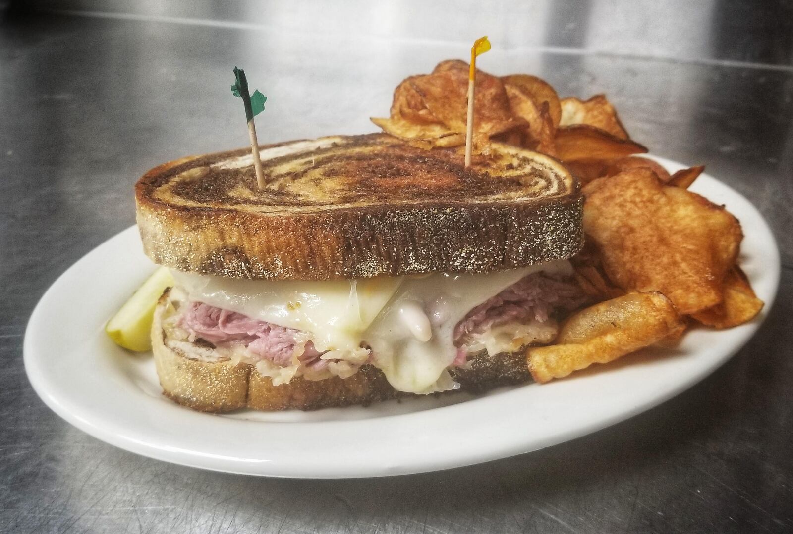 Nick's Restaurant's Reuben features house-made, slow-simmered corned beef, sauerkraut, swiss cheese, and creamy Thousand Island all on a locally sourced fresh marbled rye bread. CONTRIBUTED