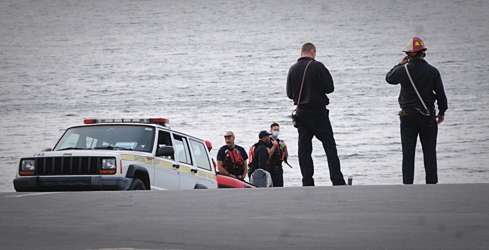 Man, dog rescued after boat overturns