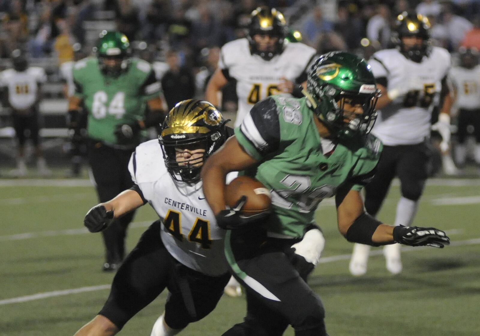 Centerville’s Max Wynn closes on Northmont’s Devin Kenerly. Northmont defeated visiting and previously unbeaten Centerville 21-14 in a Week 8 GWOC crossover high school football game on Friday, Oct. 13, 2017. MARC PENDLETON / STAFF