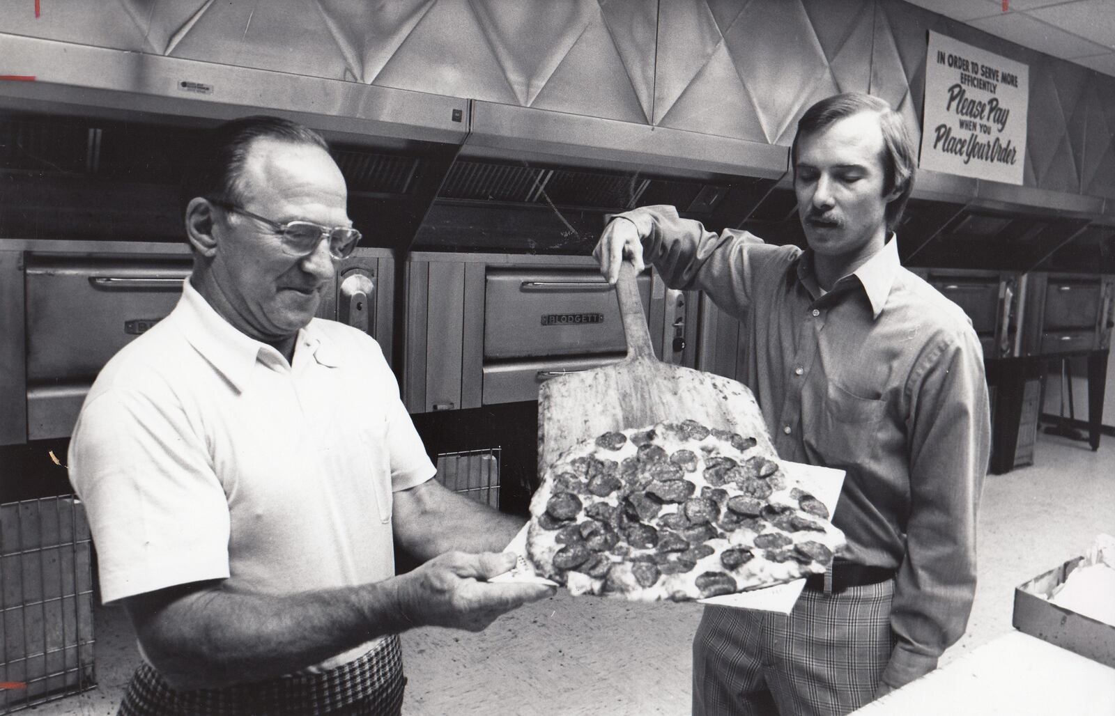 Marion Glass (left), the founder of Marion’s Piazza, and his son Roger photographed in 1976. DAYTON DAILY NEWS ARCHIVE