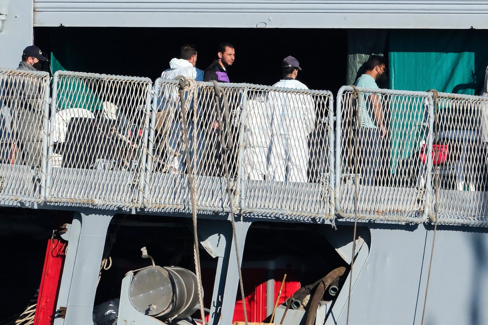 Migrants disembark from the Italian navy ship Libra at the port of Shengjin, northwestern Albania, Friday, Nov. 8, 2024, as a second group of eight migrants intercepted in international waters is processed in a reception facility despite the failure with the first group in October. (AP Photo/Vlasov Sulaj)