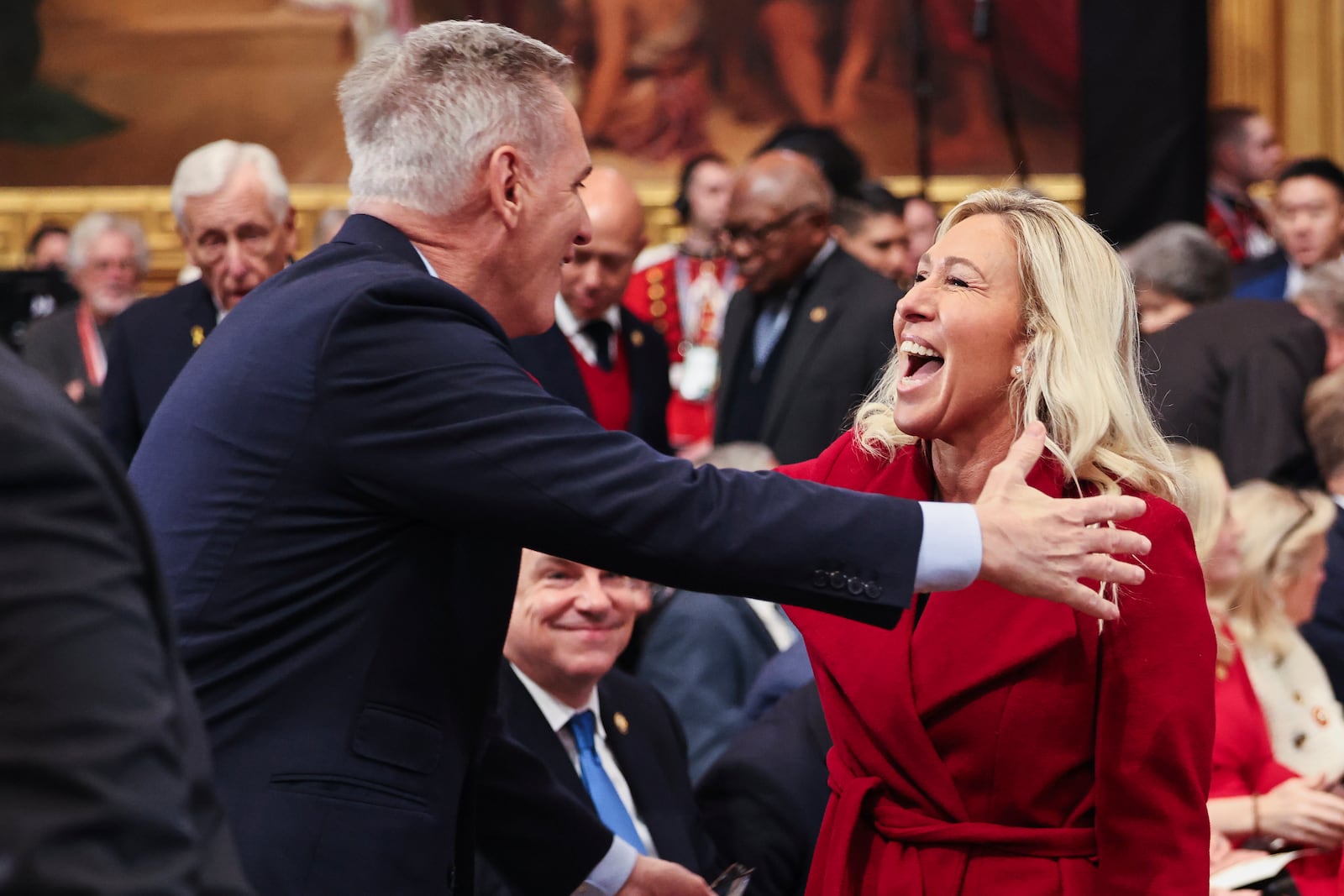 Former Speaker of the House Kevin McCarthy, left, greets Rep. Marjorie Taylor Greene, R-Ga., before the 60th Presidential Inauguration in the Rotunda of the U.S. Capitol in Washington, Monday, Jan. 20, 2025. (Chip Somodevilla/Pool Photo via AP)