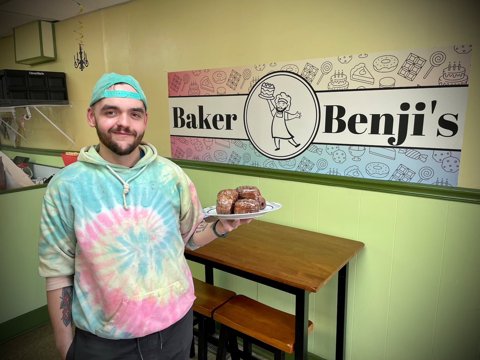 Baker Benji’s is already in the Mardi Gras spirit offering paczki, beignets, King Cake and much more. Pictured is owner Benjamin Stuckey. NATALIE JONES/STAFF