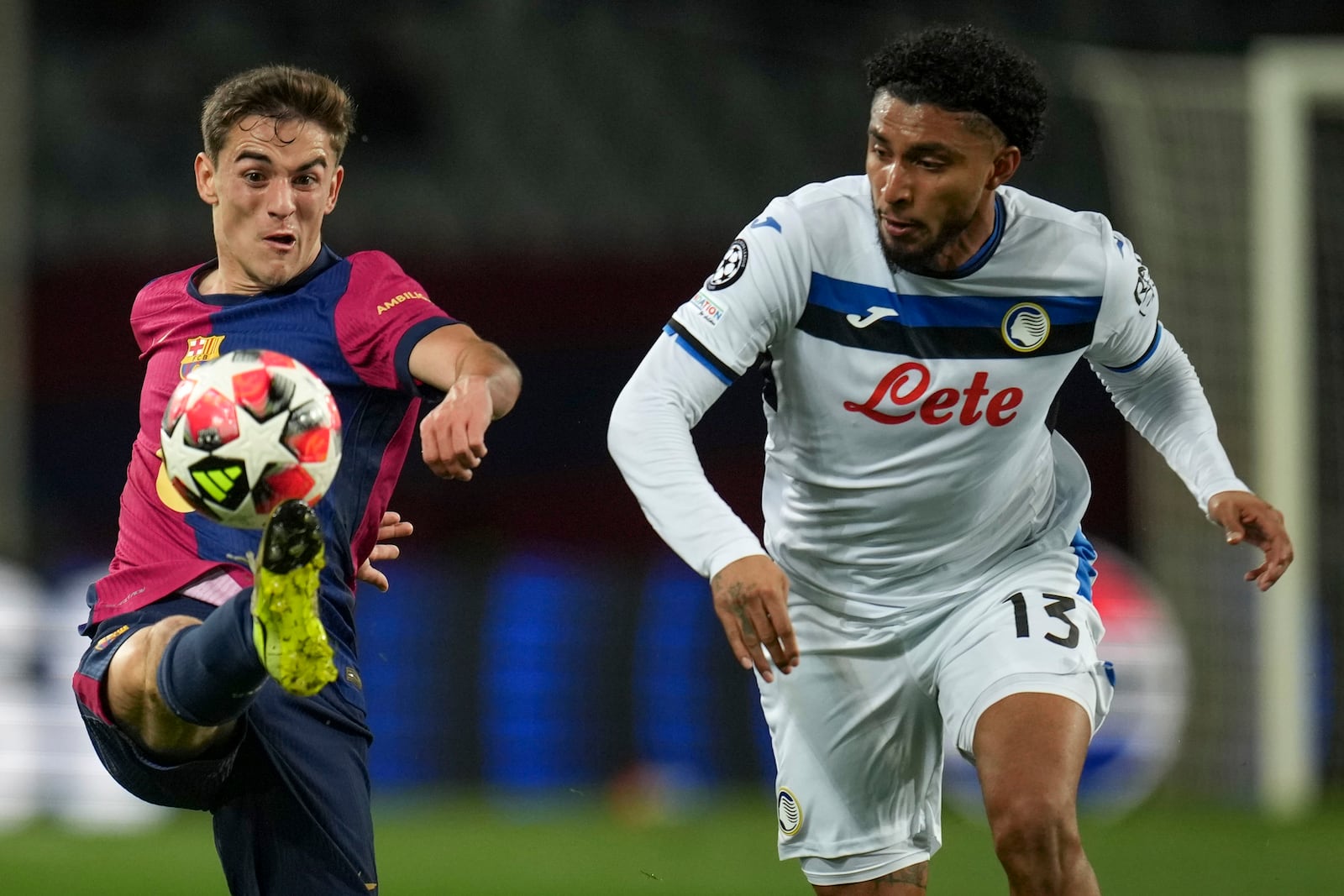 Barcelona's Gavi, left, vies for the ball with Atalanta's Ederson during a Champions League opening phase soccer between Barcelona and Atalanta match at the Lluis Companys Olympic stadium in Barcelona, Spain, Wednesday, Jan. 29, 2025. (AP Photo/Emilio Morenatti)