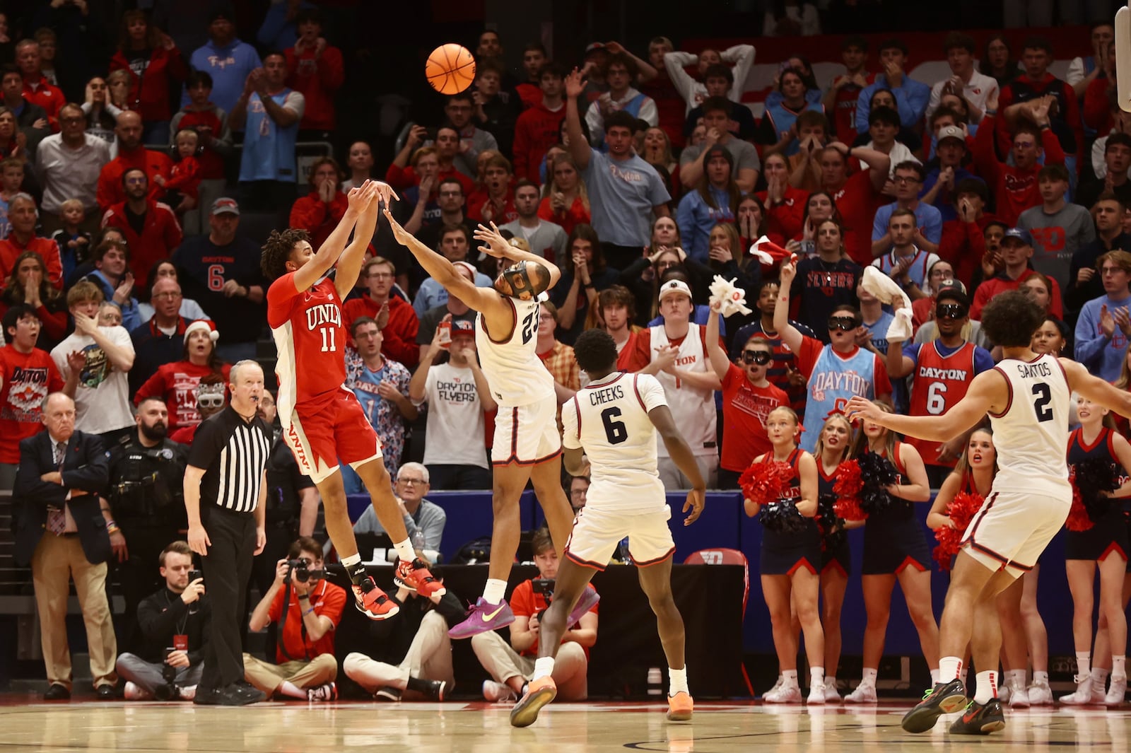 UNLV's Dedan Thomas Jr. shoots against Dayton's Zed Key in the final seconds on Tuesday, Dec. 17, 2024, at UD Arena. David Jablonski/Staff