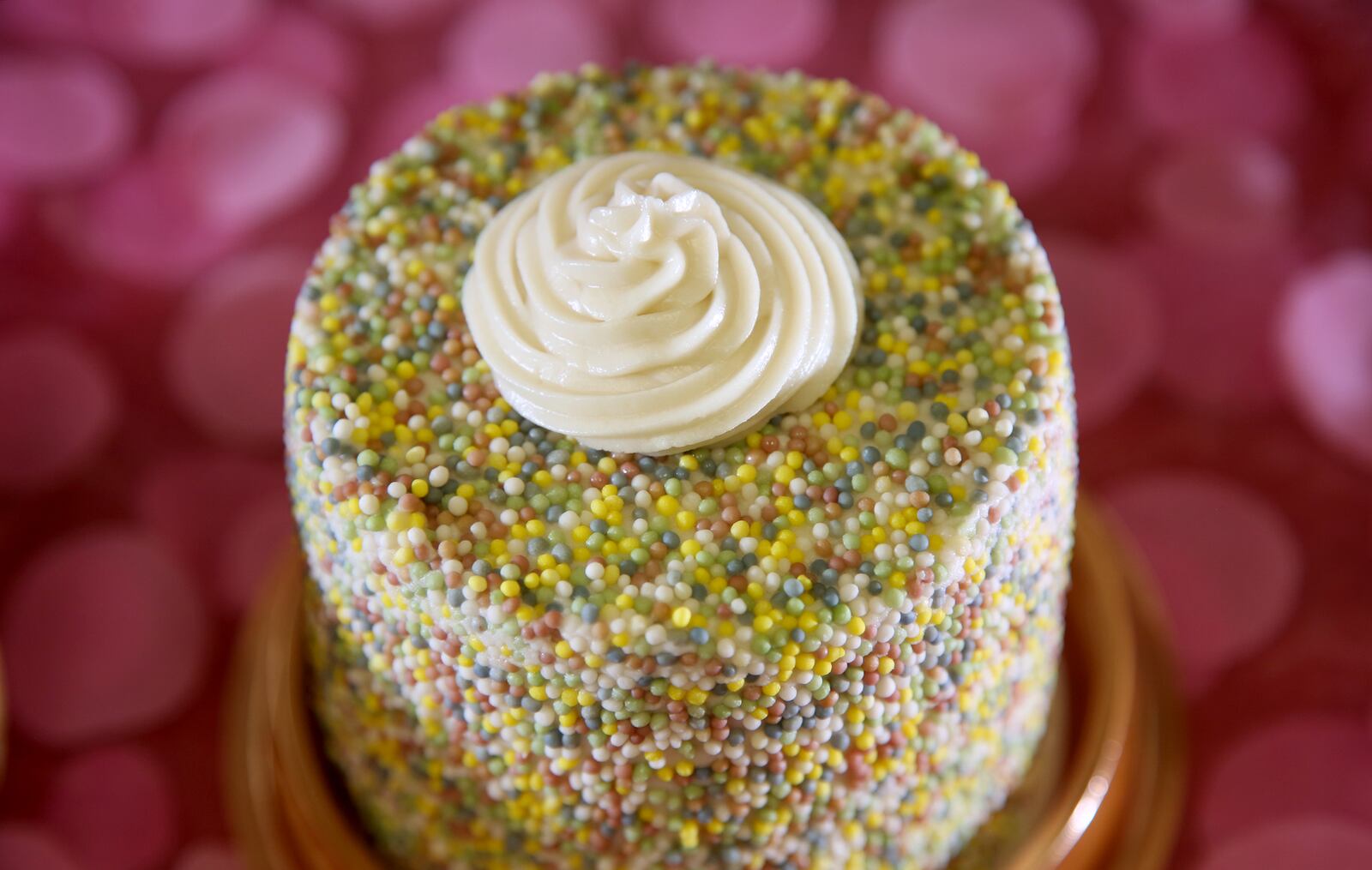 A Mini Cake for Two made with vanilla cake, cream cheese frosting and naturally dyed sprinkles made by Purely Sweet Bakery. The Beavercreek business specializes in gluten free, vegan, paleo and keto products, has a variety of baked goods perfect for Valentines Day. LISA POWELL / STAFF