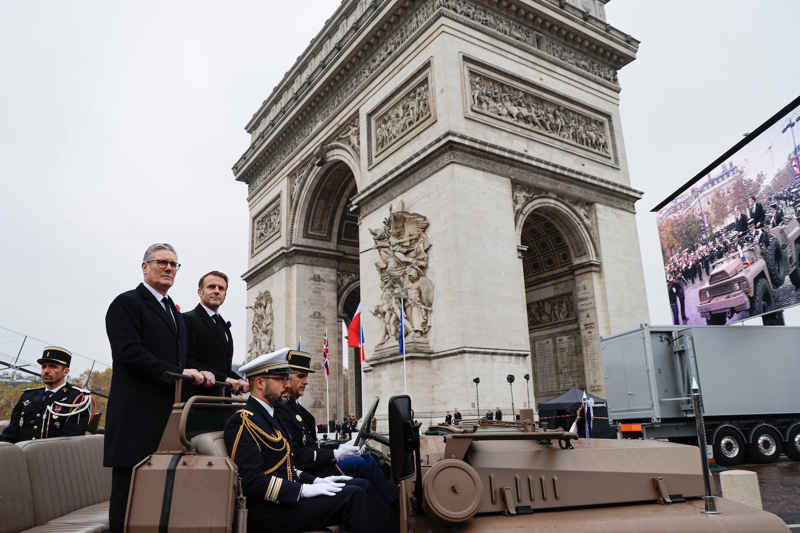 French President Emmanuel Macron, second left, and Britain's Prime Minister Keir Starmer look on upon their arrival on the Arc de Triomphe to attend commemorations marking the 106th anniversary of the November 11, 1918, Armistice, ending World War I, in Paris, Monday, Nov. 11, 2024. ( Ludovic Marin, Pool via AP)