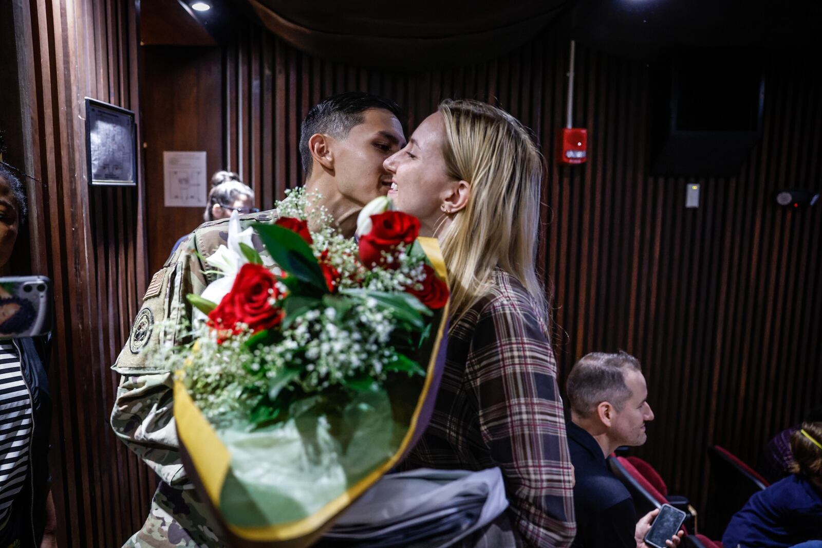 Chris Scott kisses his wife, Liana Scott after she became a U.S. citizen at the naturalization ceremony held at the Montgomery County Board of Election. Liana Scott is from Ukraine and Chris Scott is an airman at Wright-Patterson Air Force Base. JIM NOELKER/STAFF