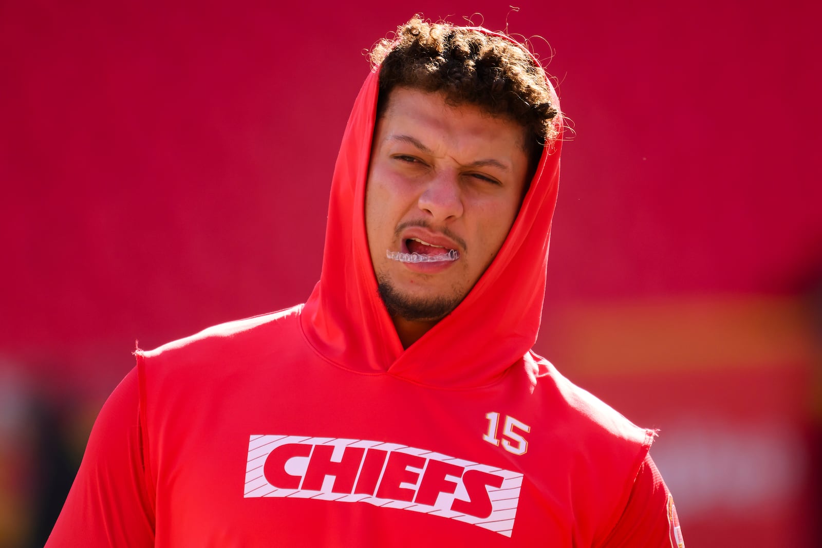 FILE - Kansas City Chiefs quarterback Patrick Mahomes chews his mouth guard during warmups before an NFL football game against the Denver Broncos, Sunday, Nov. 10, 2024 in Kansas City, Mo. (AP Photo/Reed Hoffmann, File)