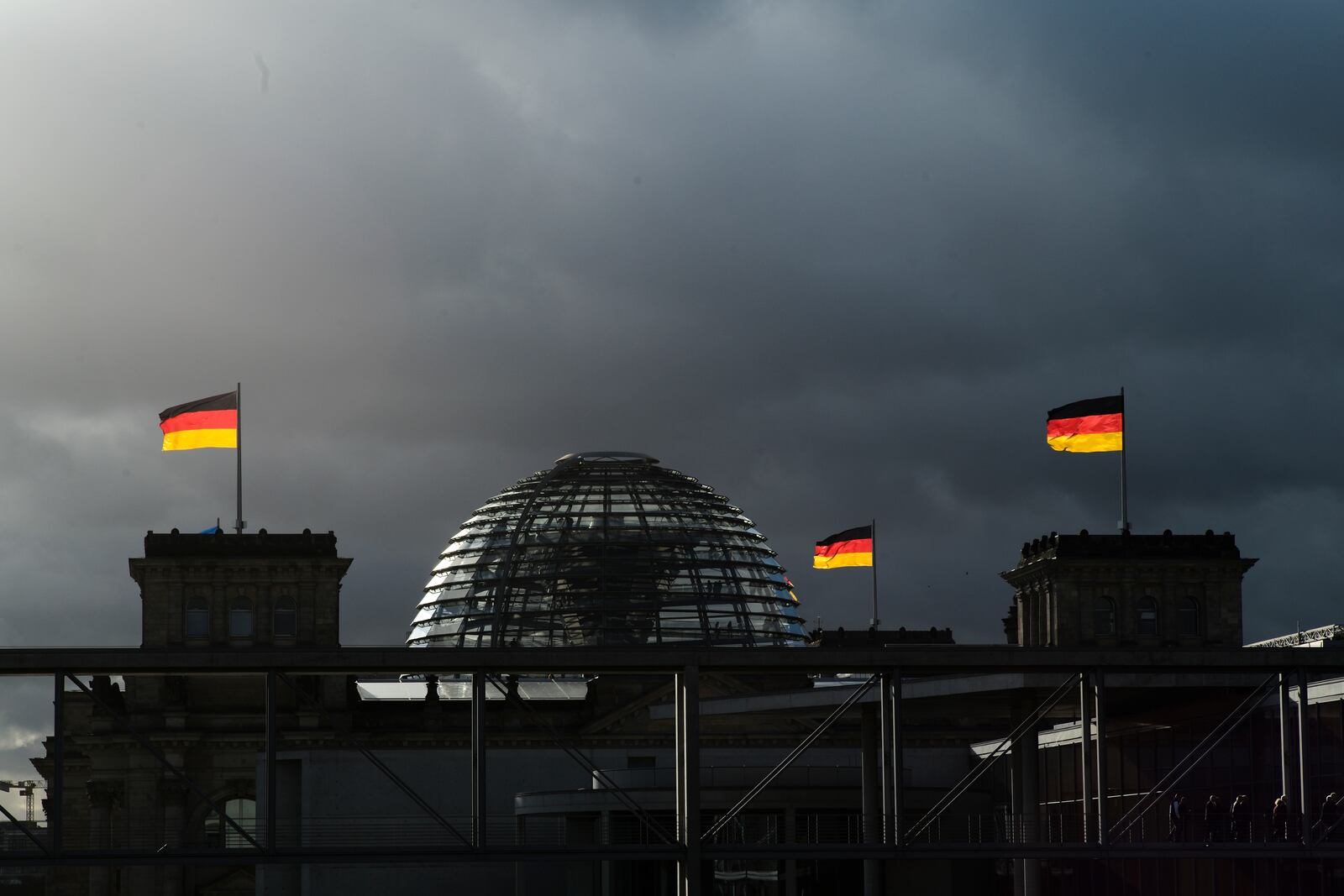 FILE - In this Friday, Nov. 29, 2019 file photo, German national flags catch the sun on top of the German parliament building, the Reichstag building in Berlin, Germany, Sunday, Sept. 26, 2021.(Photo/Markus Schreiber, File)