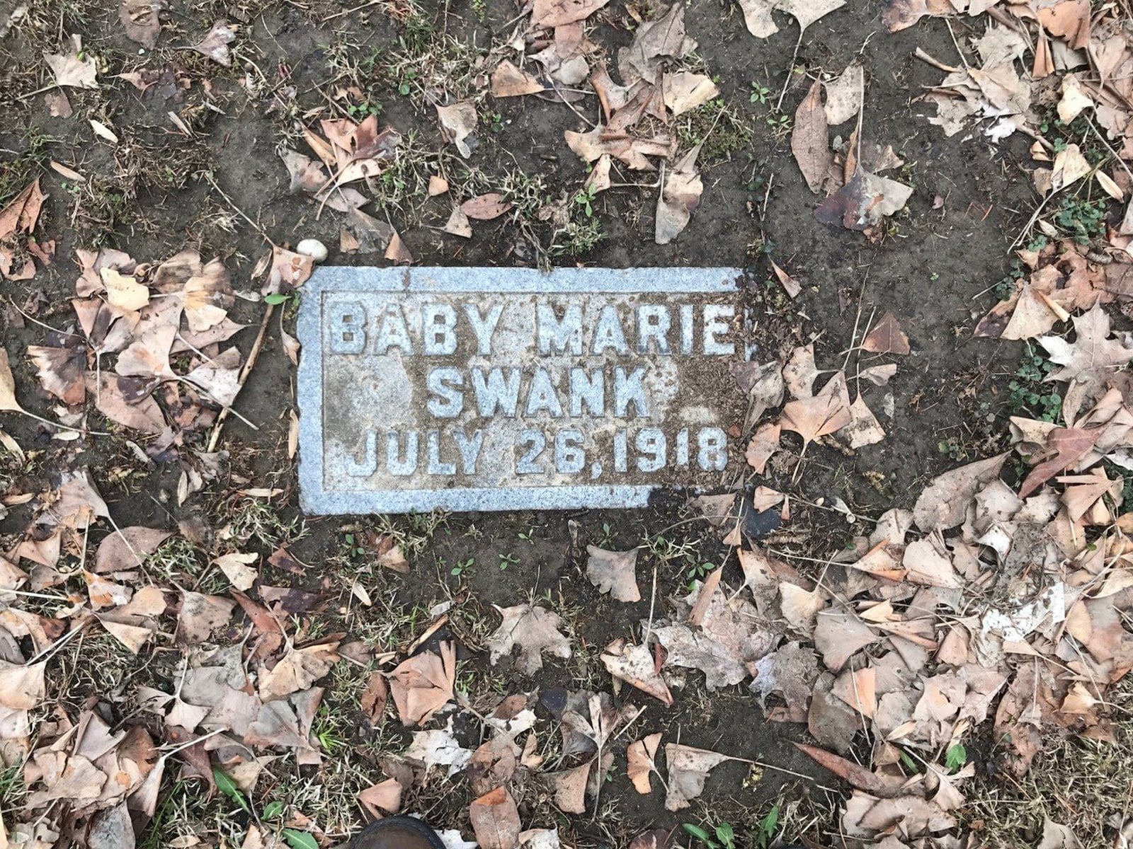 A gravestone at Woodland Cemetery. Tom Archeacon/STAFF