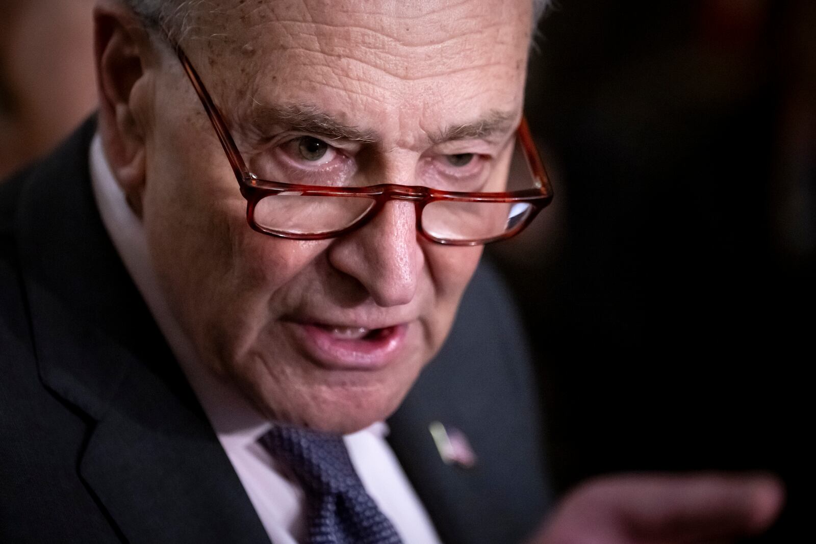 Sen. Chuck Schumer, D-N.Y., speaks to reporters after a Senate policy luncheon, at the Capitol in Washington, Tuesday, Feb. 25, 2025. (AP Photo/Ben Curtis)