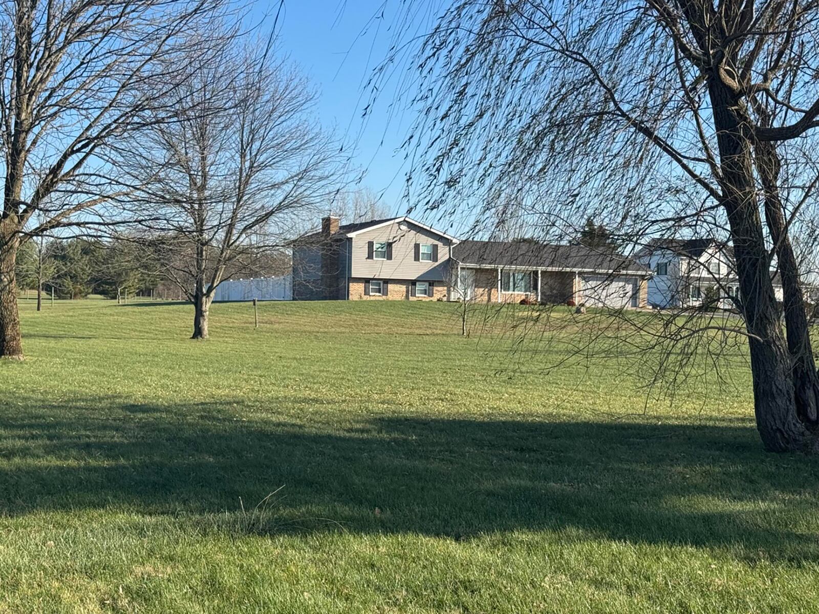 The lot has mature trees and has views of the country.