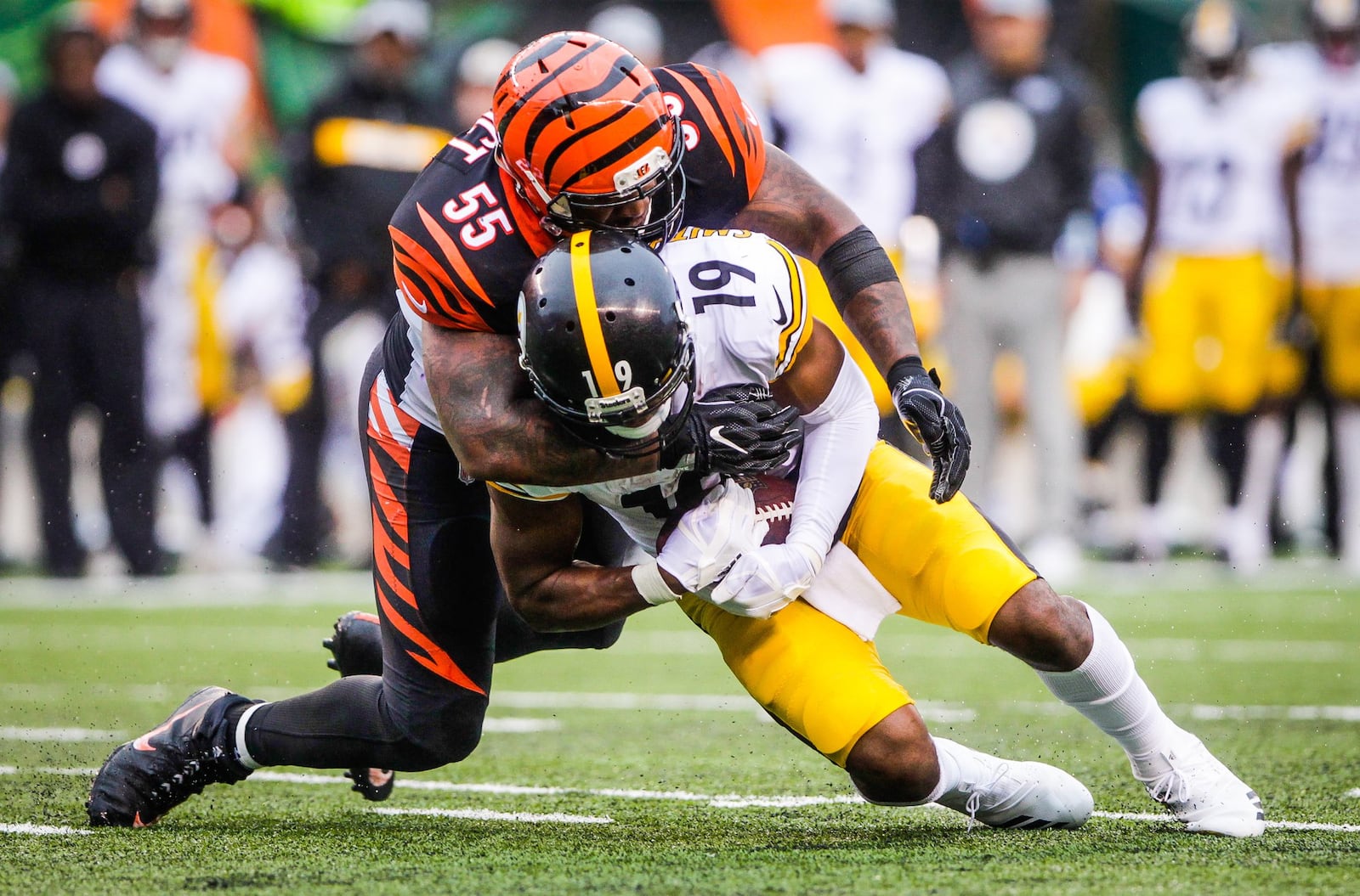 Cincinnati Bengals linebacker Vontaze Burfict tackles Pittsburgh Steelers wide receiver JuJu Smith-Schuster during their game Sunday, Oct. 14 at Paul Brown Stadium in Cincinnati. The Steelers won 28-21. NICK GRAHAM/STAFF