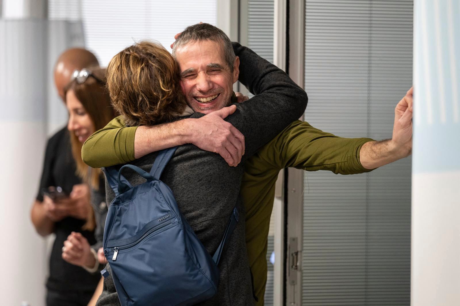 FILE - Fernando Simon Marman, right, hugs a relative after being rescued from captivity in the Gaza Strip, in Ramat Gan, Israel, on Feb. 12, 2024. (Israeli Army via AP, File)