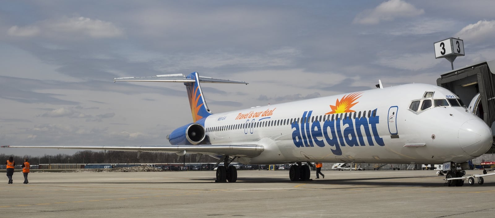 A small plane with a banner flies over Flint Bishop Airport to celebrate the ribbon cutting for Allegiant Air joining Flint Bishop International Airport on Wednesday, April 13, 2016. Allegiant will serve Flint with nonstop flights to Tampa/St. Pete and Orlando/Sanford. (Conor Ralph/The Flint Journal- MLive.com via AP)