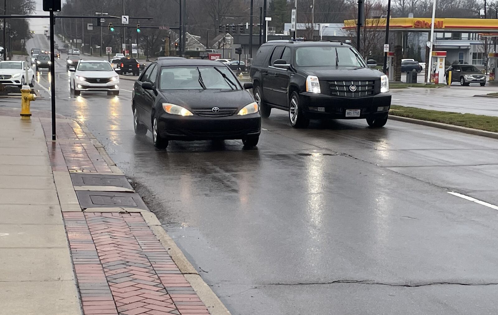 Part of Stroop Road near the Town & Country Shopping Center in Kettering will be repaved in 2025 asphalt resurfacing program, according to the city.  NICK BLIZZARD/STAFF