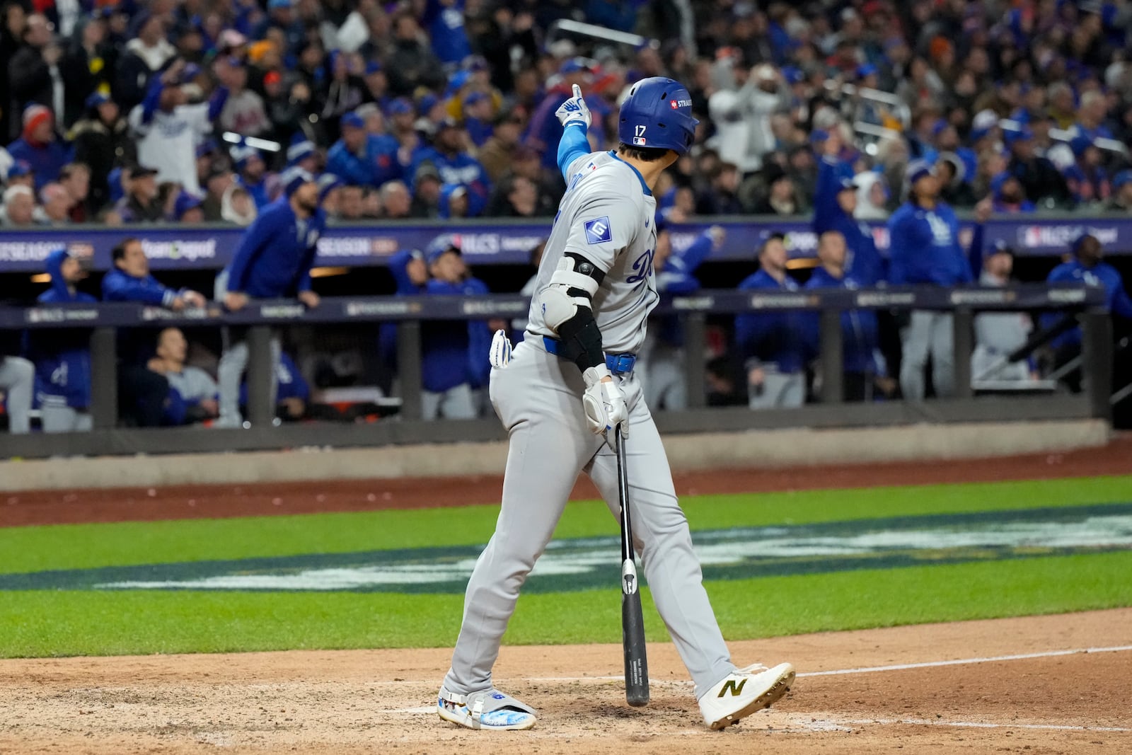 Los Angeles Dodgers' Shohei Ohtani celebrates his three-run home run against the New York Mets during the eighth inning in Game 3 of a baseball NL Championship Series, Wednesday, Oct. 16, 2024, in New York. (AP Photo/Ashley Landis)