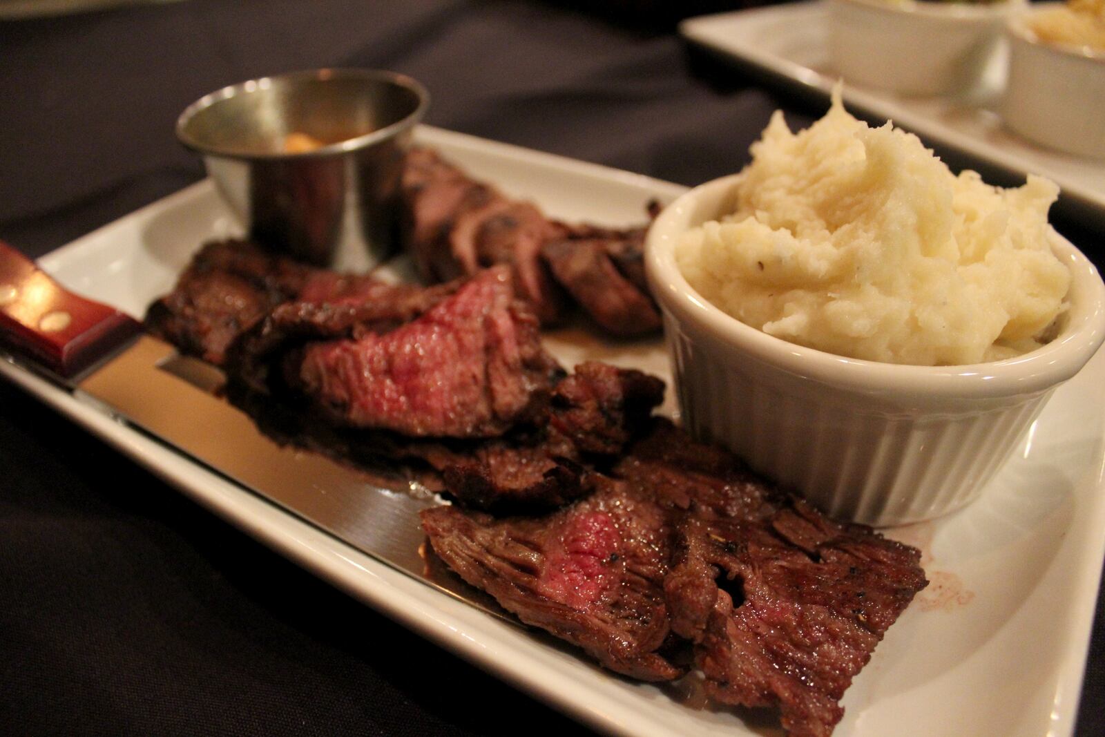 The Bison and The Boar in West Alexandria will celebrate its opening Friday, Feb. 22. Pictured: Forest and Field duo ( six ounce boar and  sic ounce beef tenderloin ) with a side of mash potatoes an Cajun compound butter.