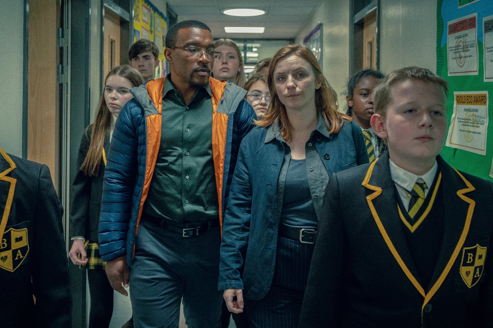 This image released by Netflix shows Ashley Walters, center left, and Faye Marsay, center right, in a scene from "Adolescence." (Netflix via AP)