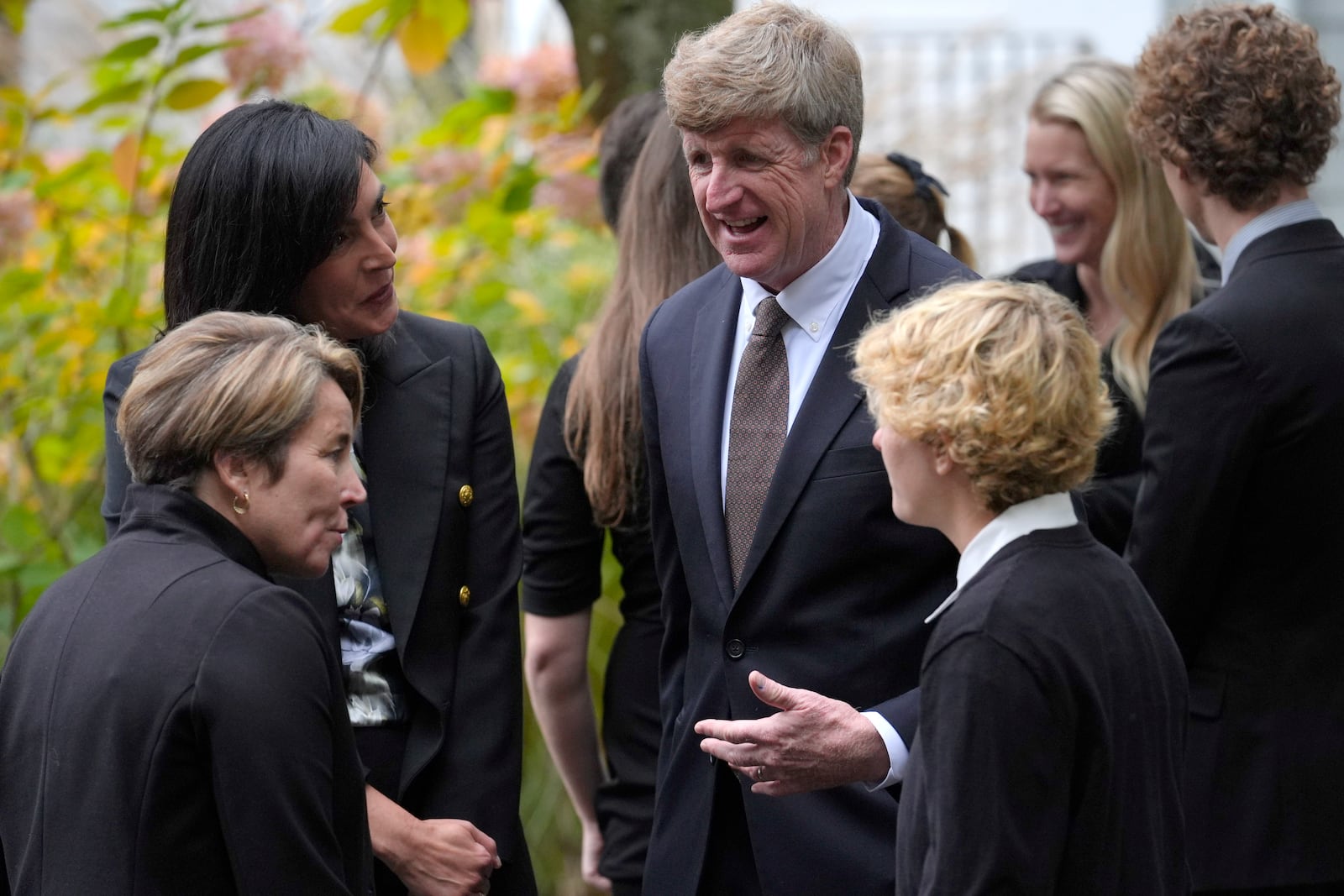 Former U.S. Rep. Patrick Kennedy, center right above, grandson of the late Ethel Kennedy, speaks with Massachusetts Gov. Maura Healey, below left, as they depart Our Lady of Victory church following funeral services for Ethel Kennedy, wife of Sen. Robert F. Kennedy, Monday, Oct. 14, 2024, in Centerville, Mass. (AP Photo/Steven Senne)