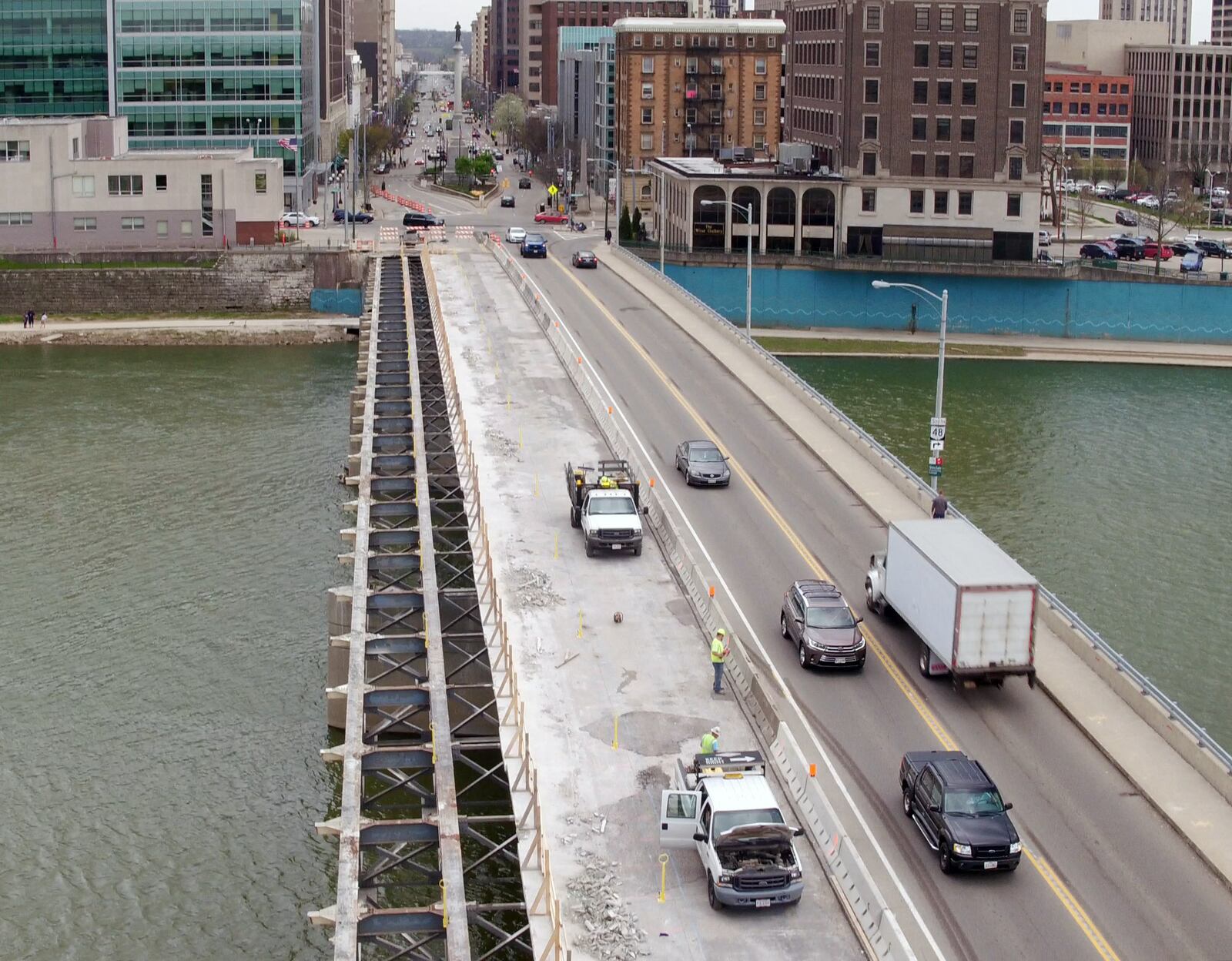 Renovation of the Main Street Bridge over the Great Miami River in downtown Dayton has traffic squeezed to one lane in each direction.The $8.8 million project began in March involves replacing the decking, sidewalks and lighting from the beams up.  Bridge decking from the east sidewalk removed, leaving just the beams exposed.  The 62 -year-old bridge renovation is an Ohio Department of Transportation project that is expected to take a year to complete.   TY GREENLEES / STAFF